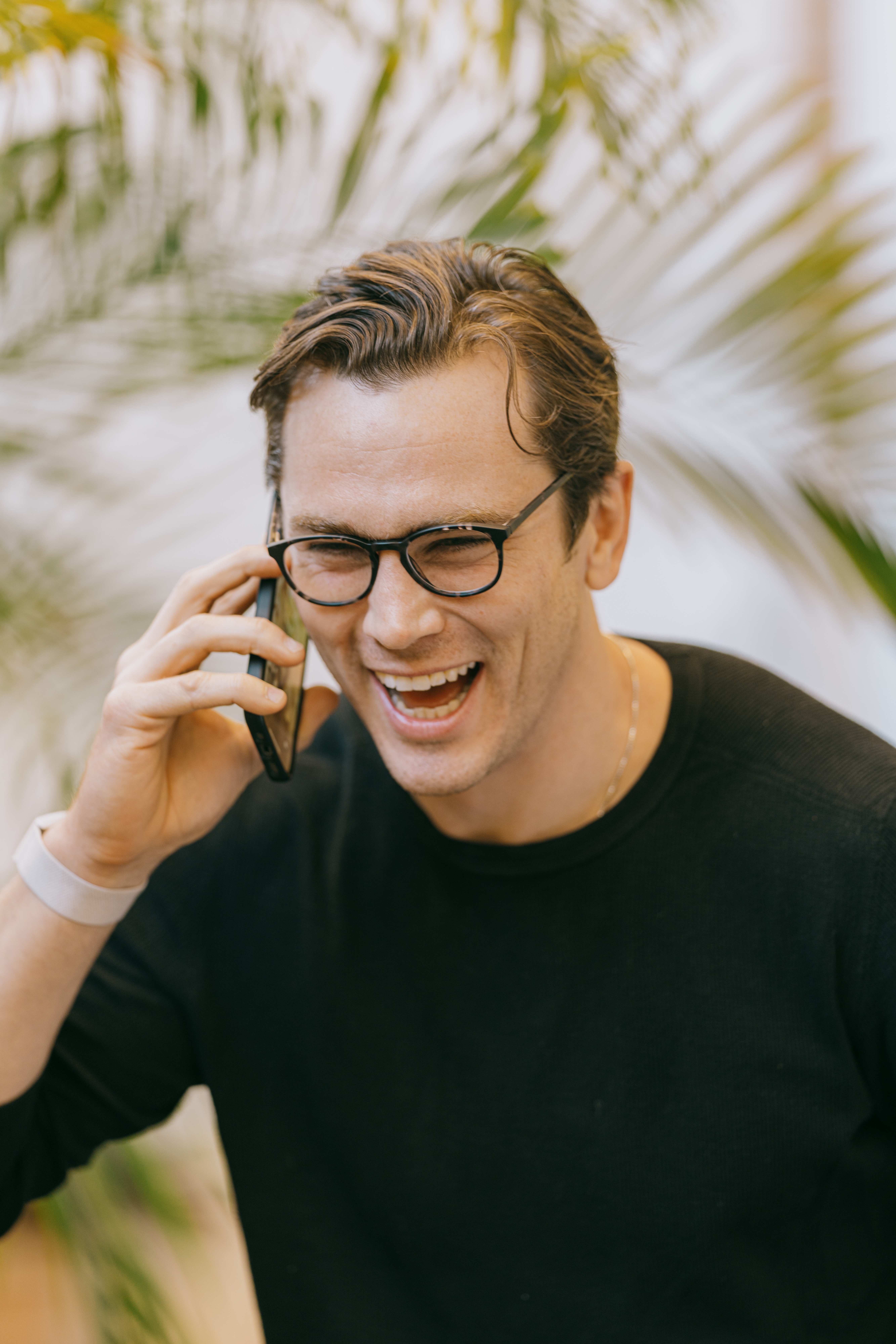 Derek on phone smiling