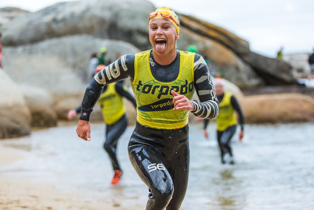 Athletes trail running along Cape Town coastline