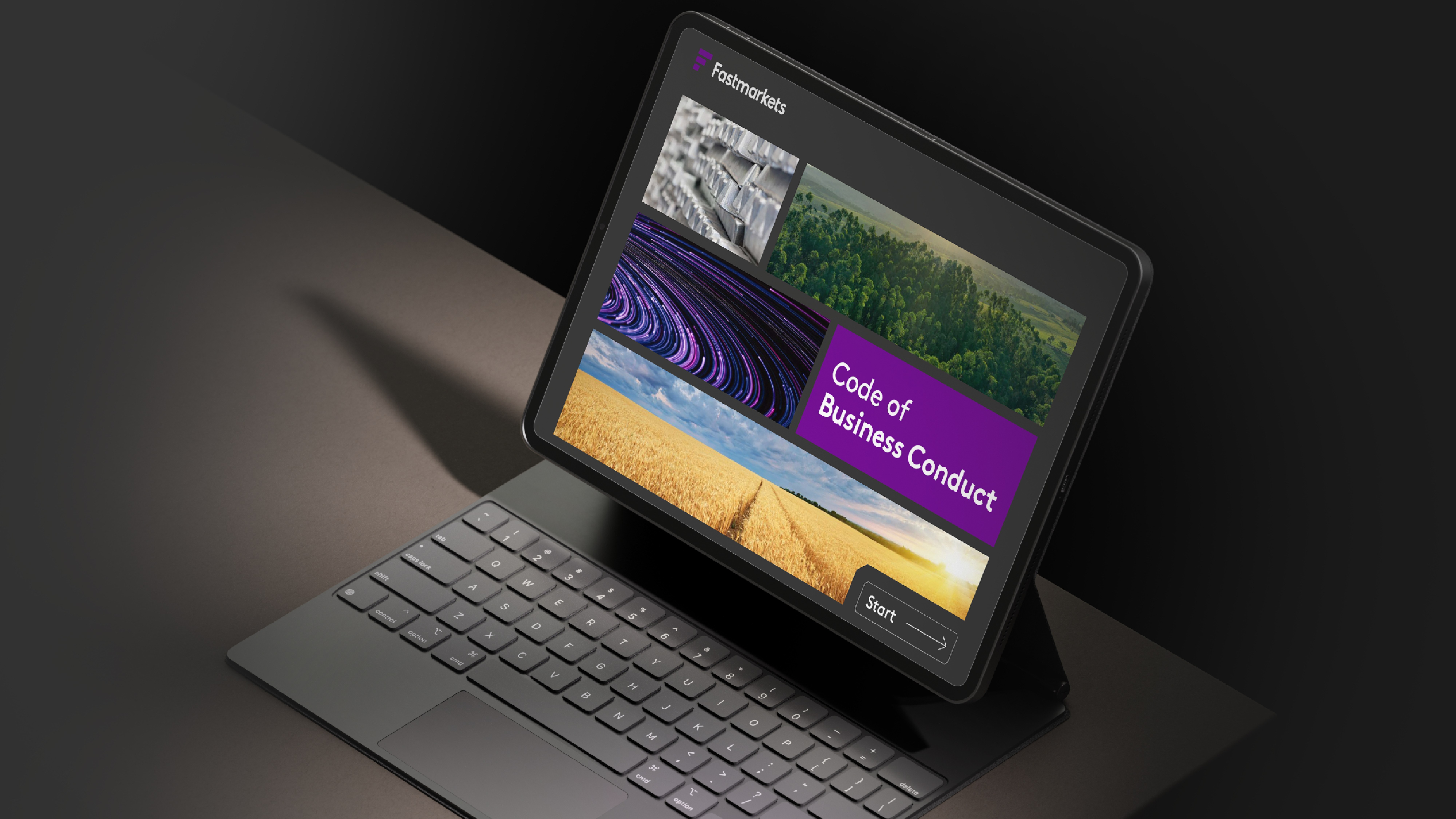 Fastmarkets Code of Business Conduct cover on iPad with keyboard