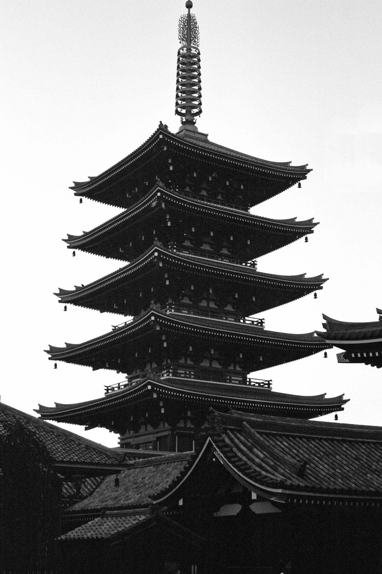 Black and white dramatic silhouette five-story pagoda Sensoji Temple against bright sky