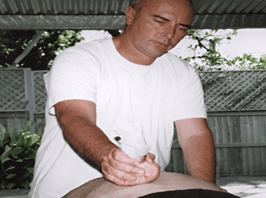 Kadama performing Siddha Vaidya massage on a client
