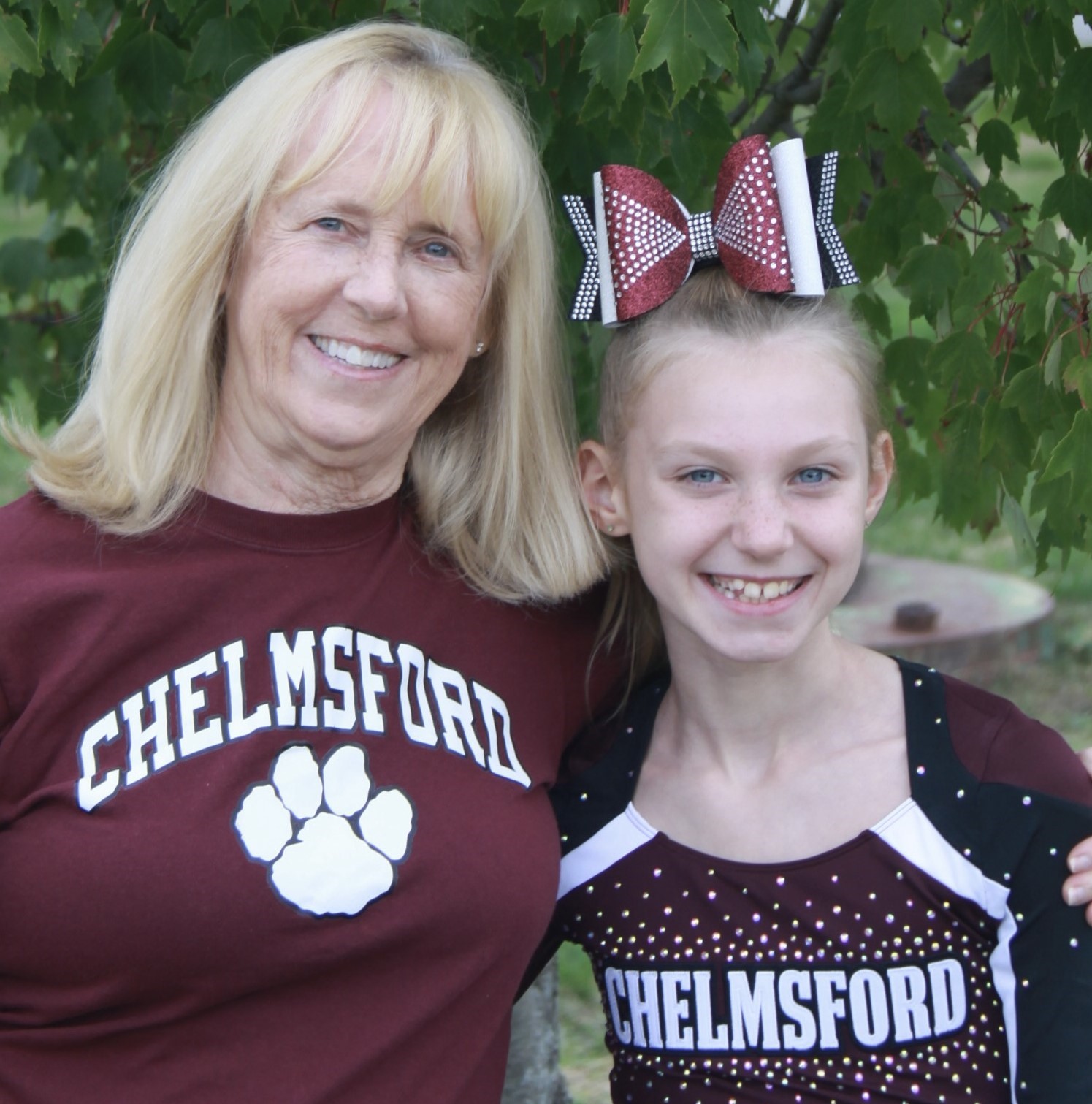 Karla Miller with her granddaughter, both wearing Chelmsford shirts