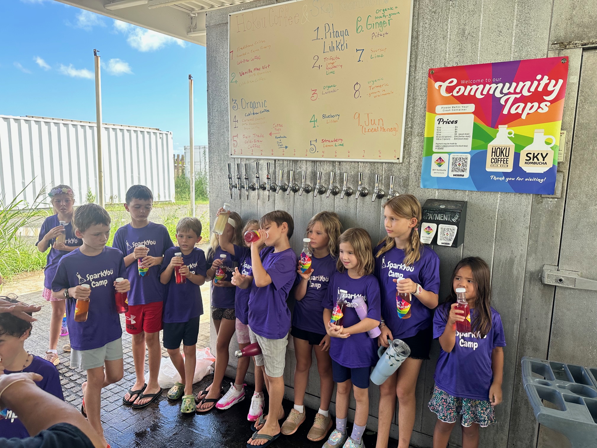 Kids from SparkYou Camp at tap wall