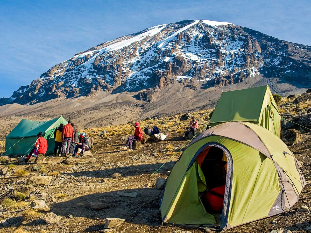 Tents at Machame camp with Mount Kilimanjaro in the background