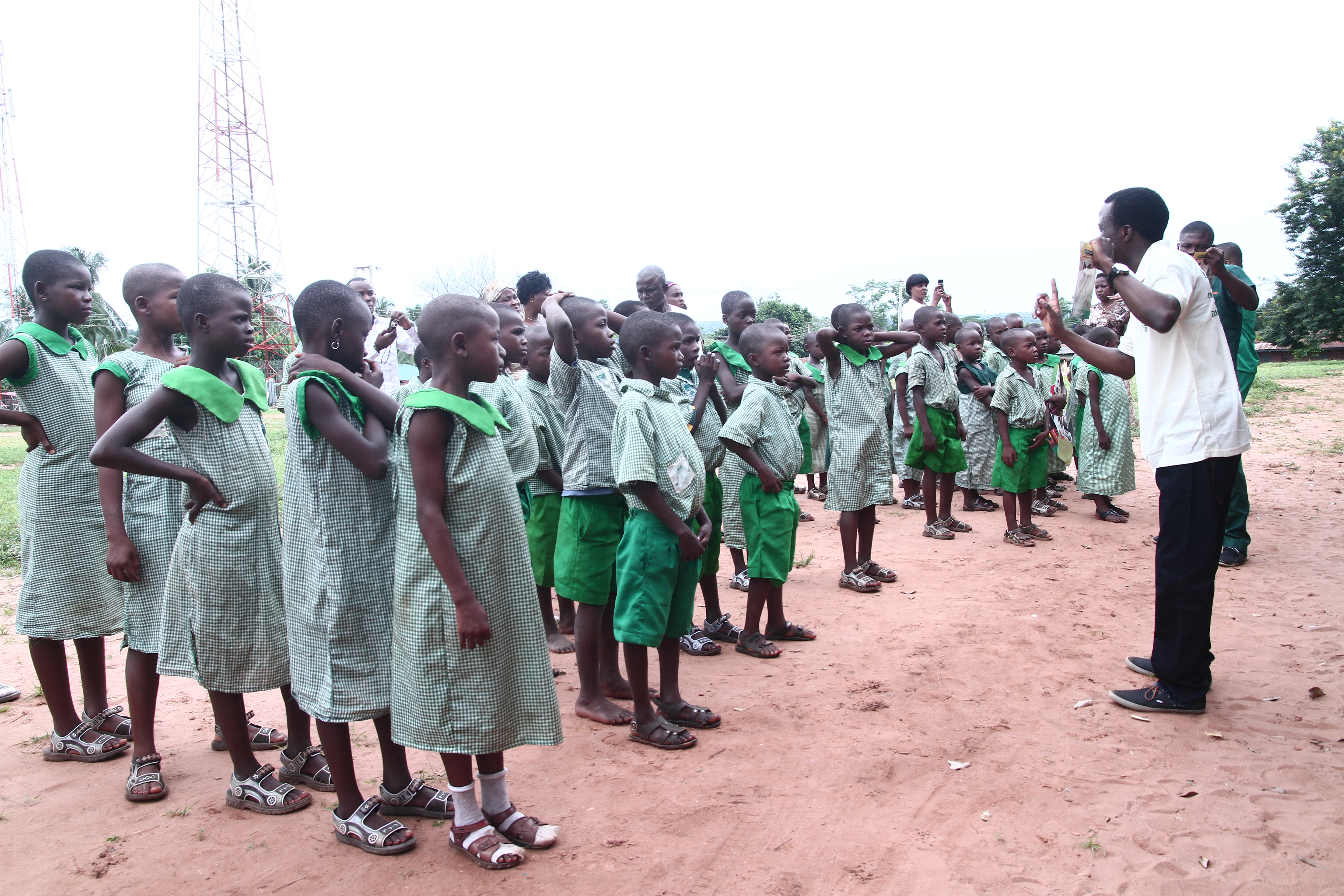 Team teaching school children about dental hygiene