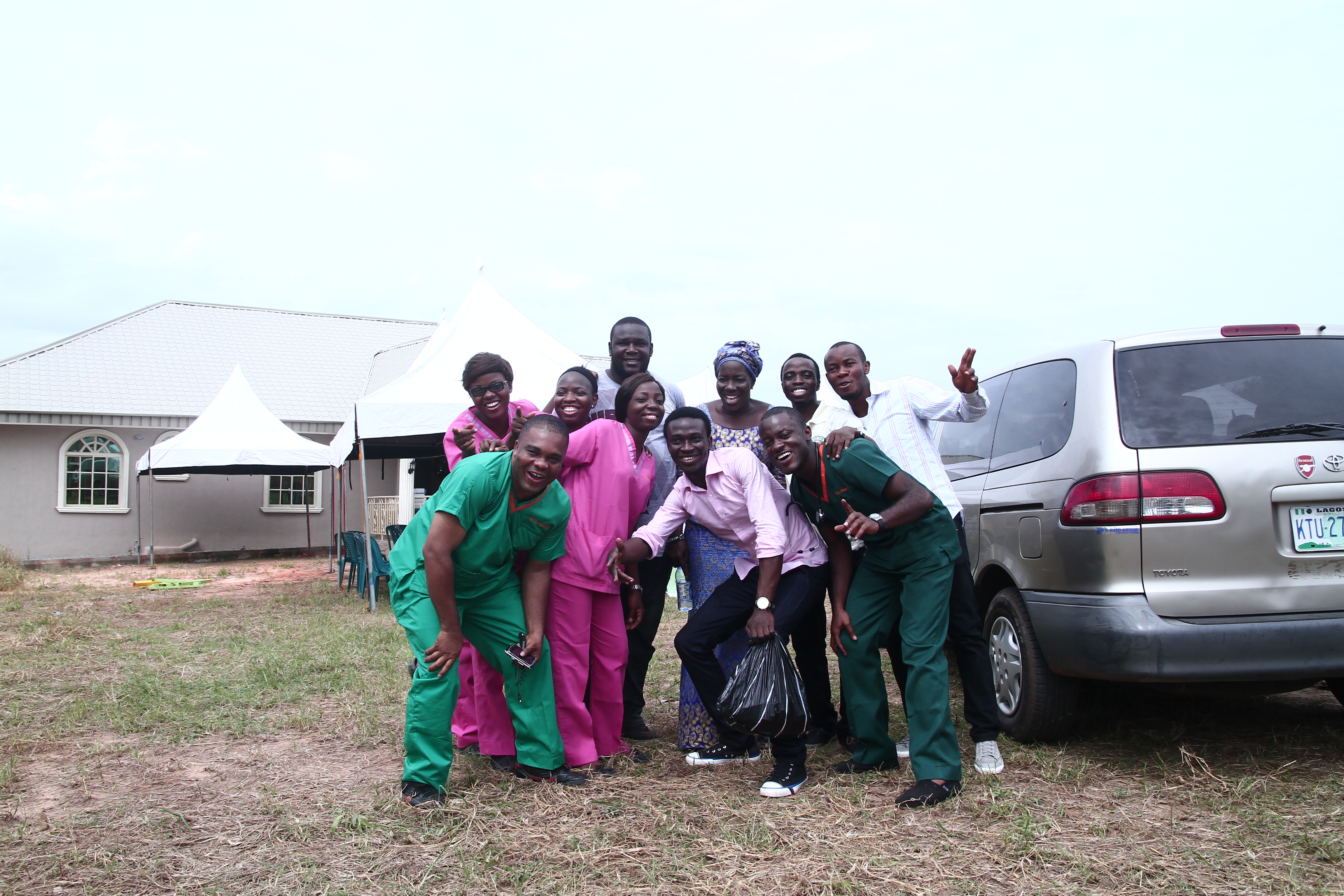 Team posing by Toyota van