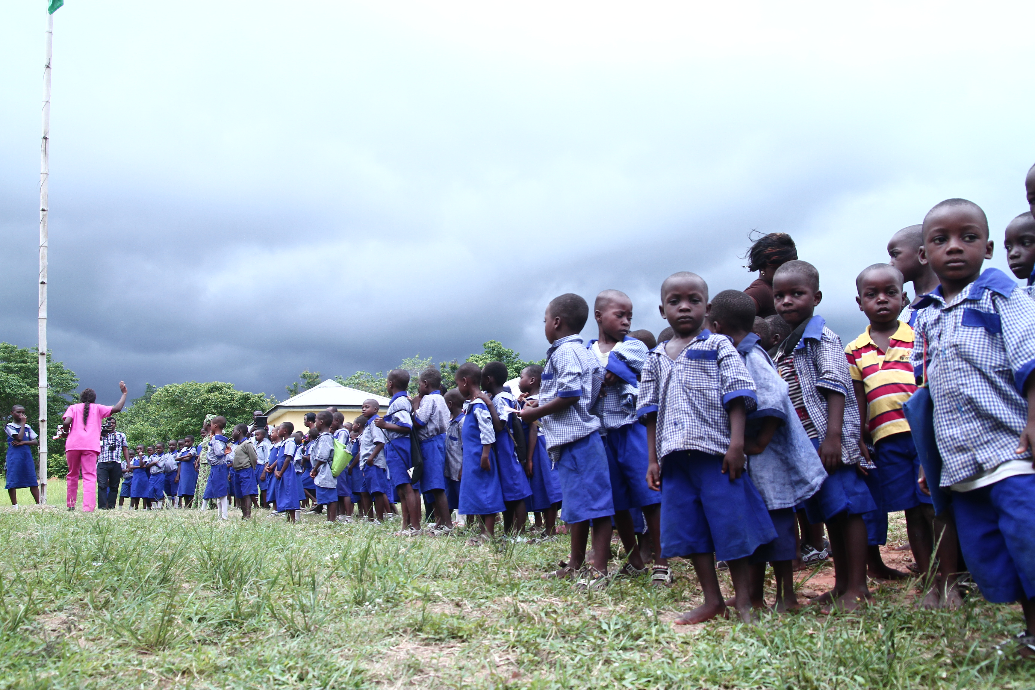 Long line of pupils under dramatic sky