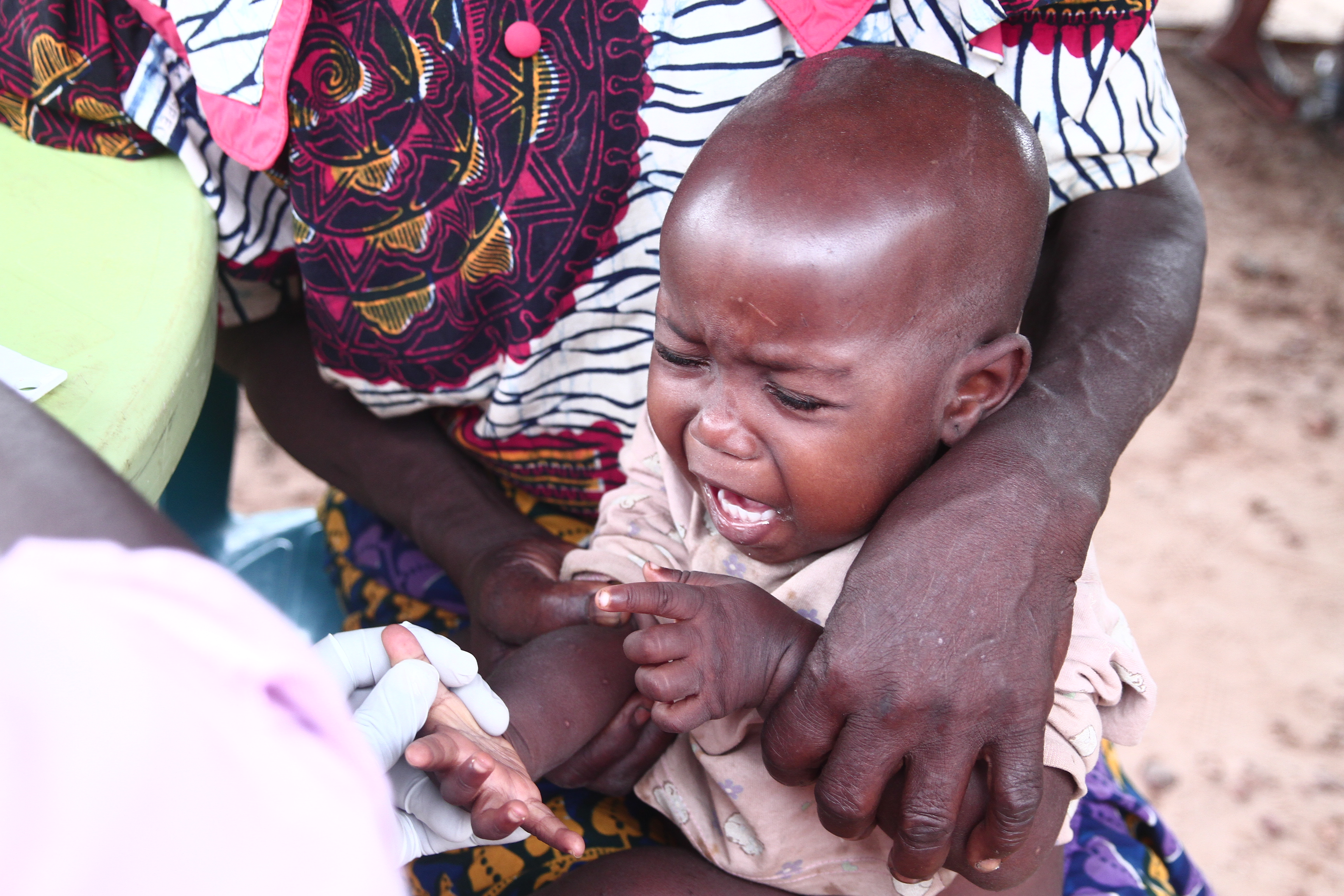 Baby being examined by medical team