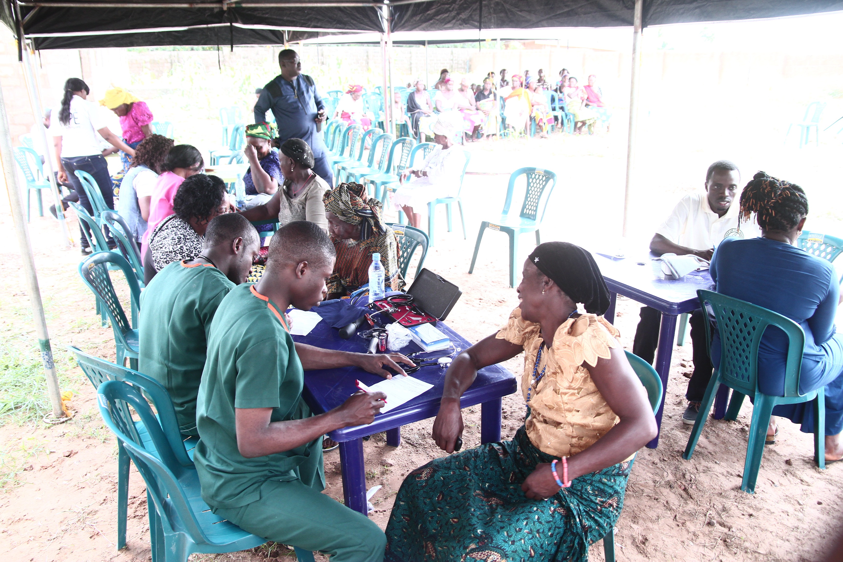 Doctor performing consultation on elderly woman