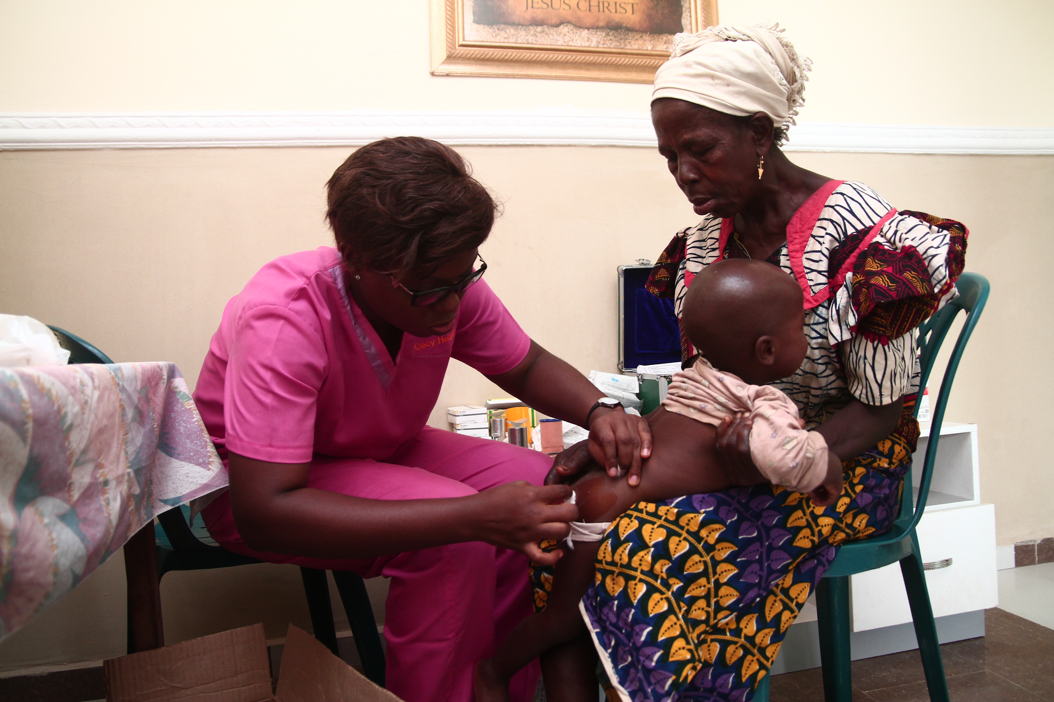 Nurse treating infant