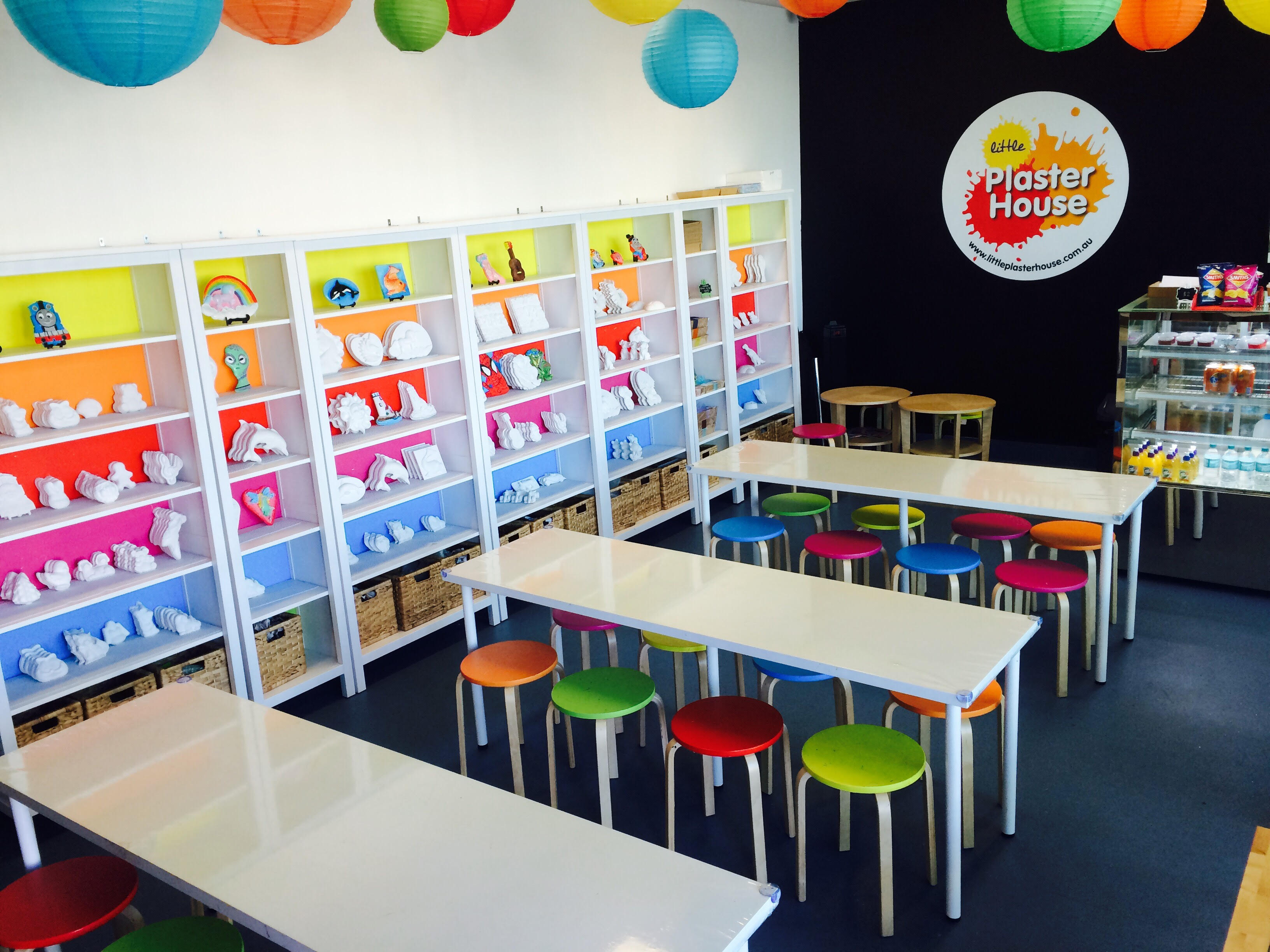 Little Plaster House studio interior with colourful shelving and plaster figurines