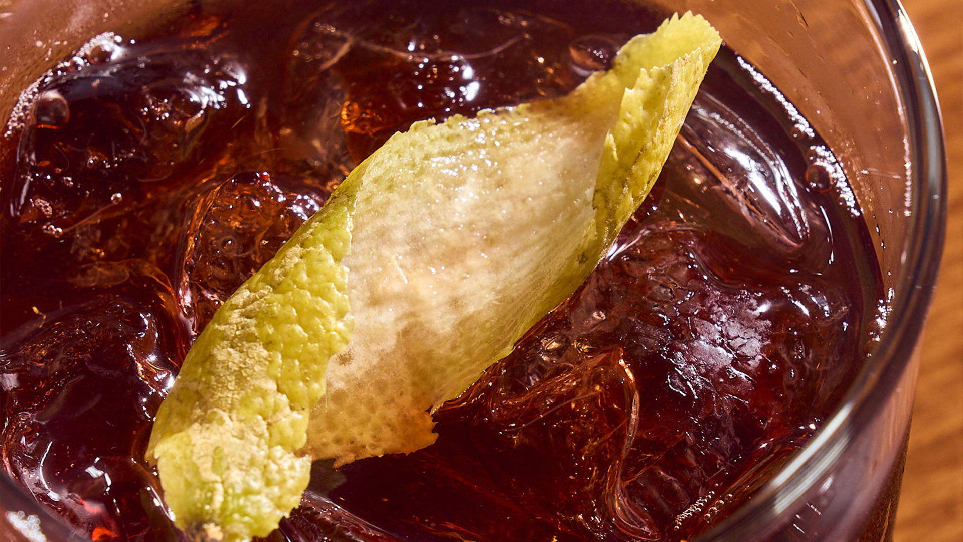 A rum cocktail over ice with a citrus peel from La Traila's Rum Dinner
