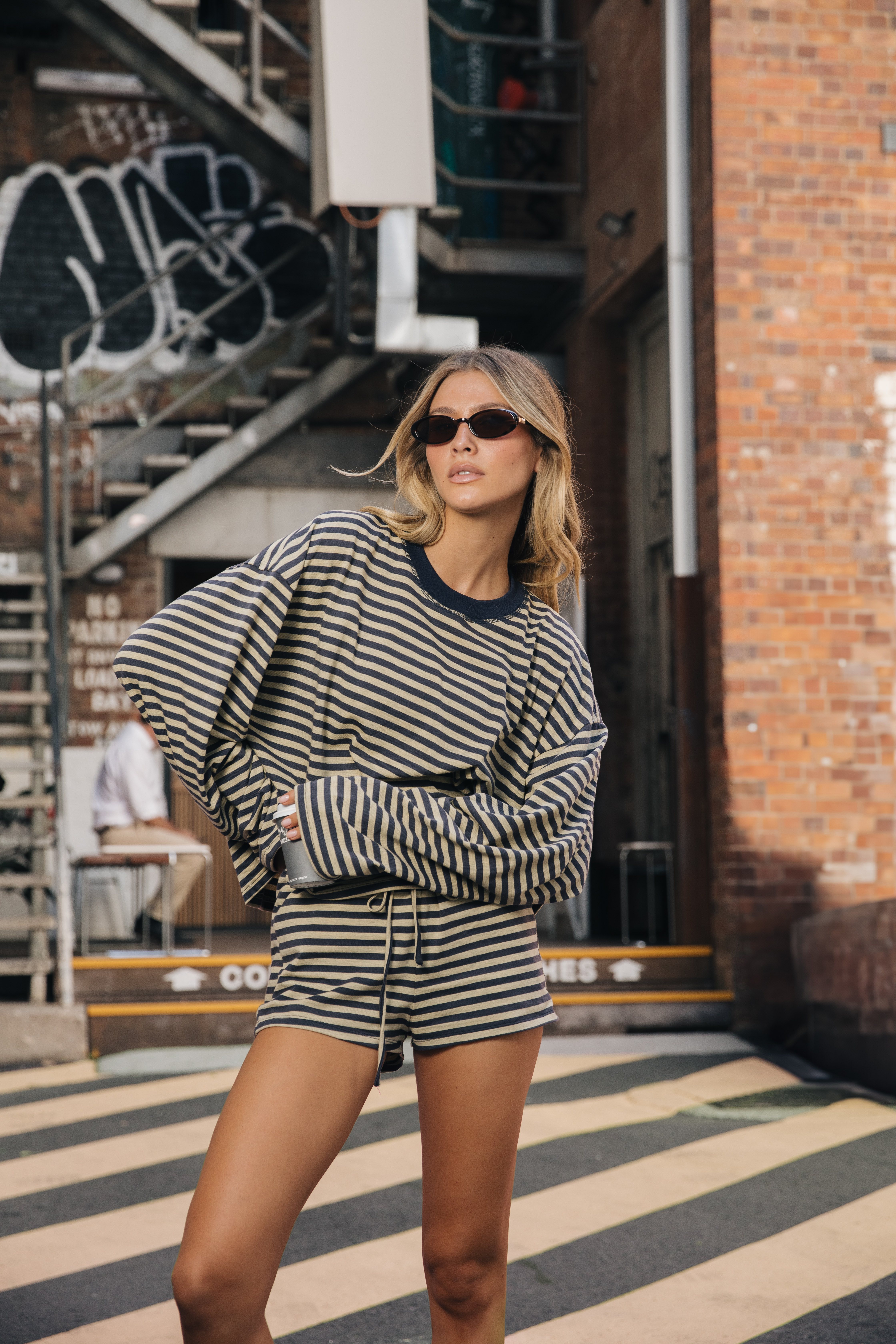 Leilani in striped matching set urban laneway graffiti