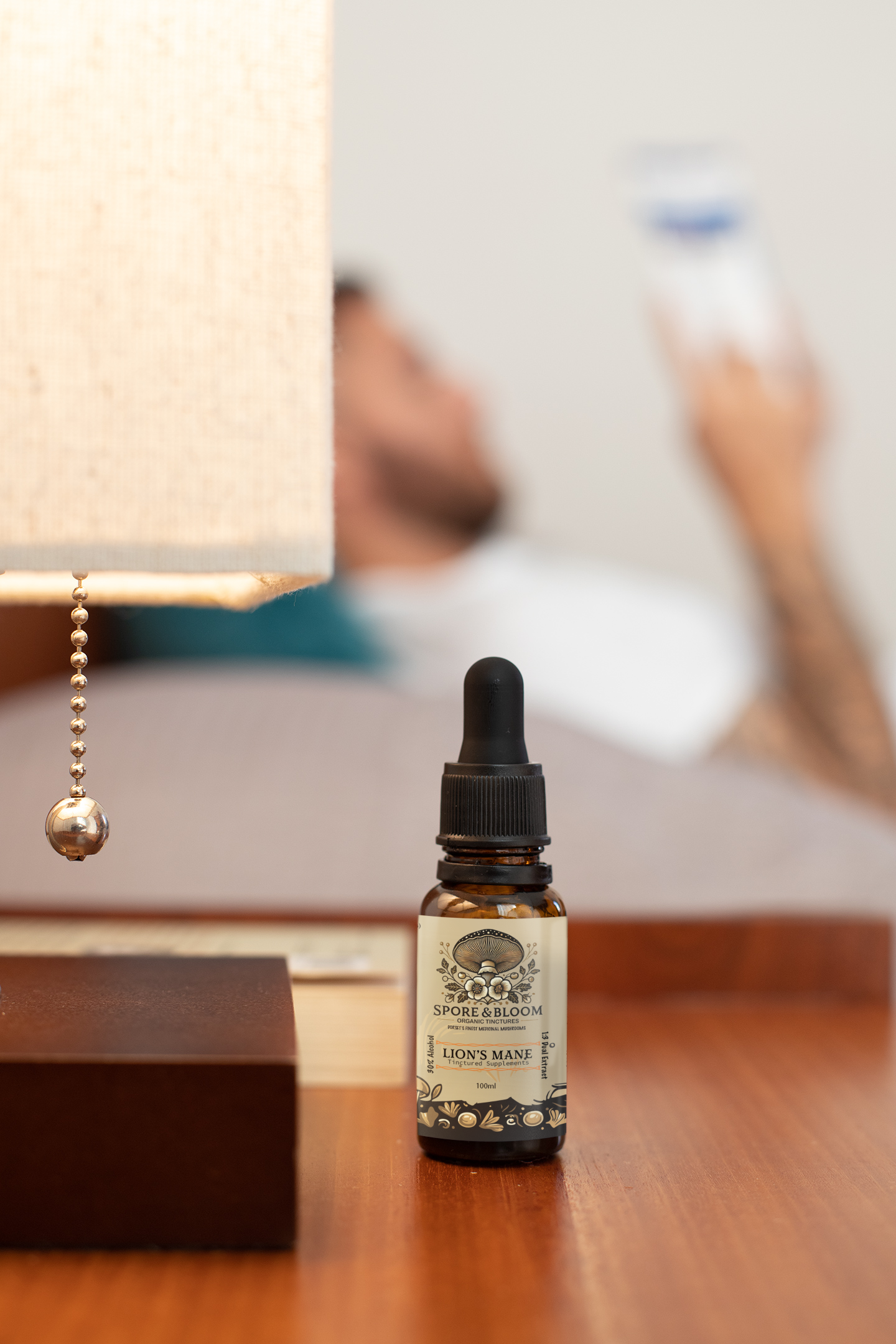 Spore & Bloom Lion's Mane tincture in a cozy setting