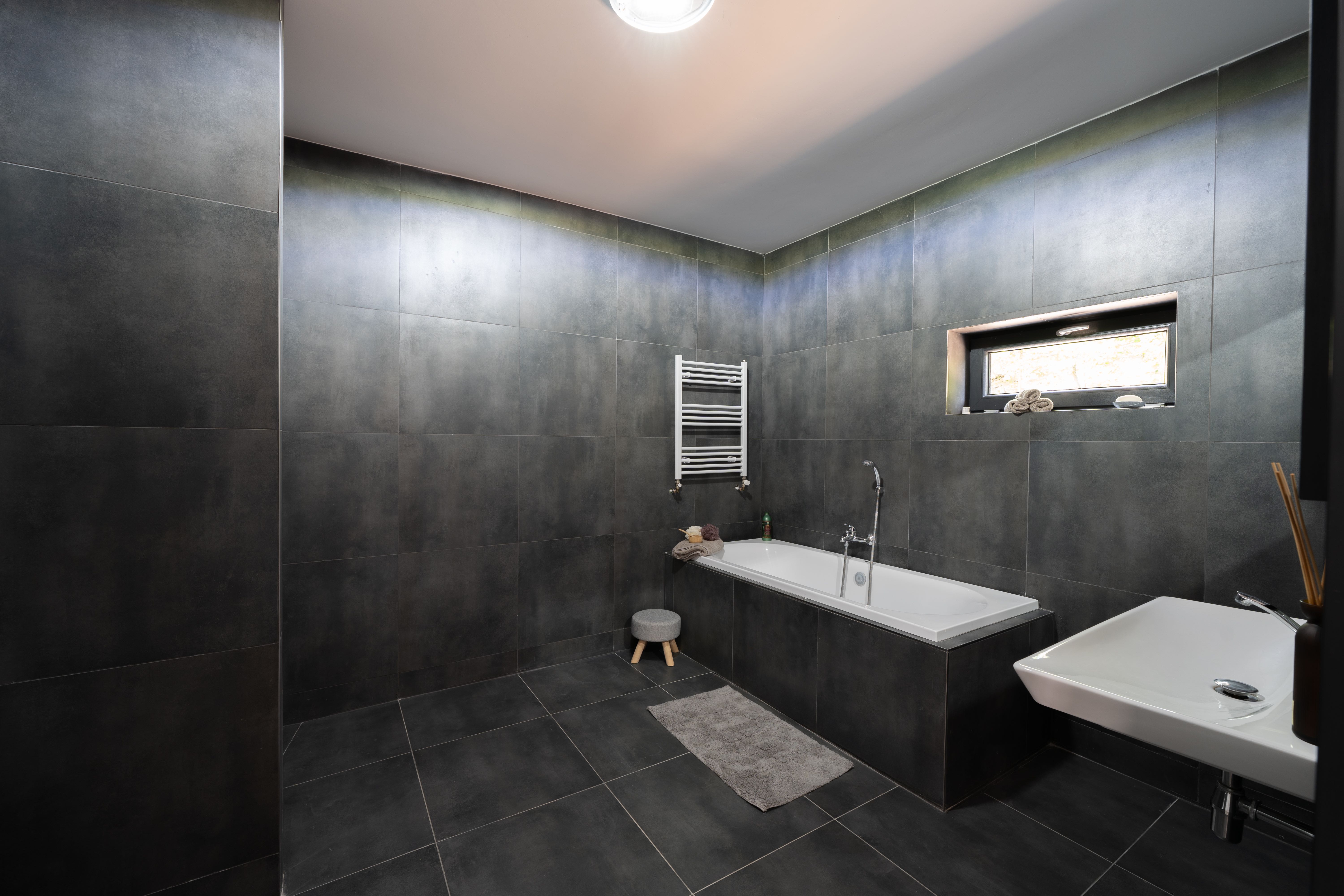 Bathroom with tub and walk-in shower