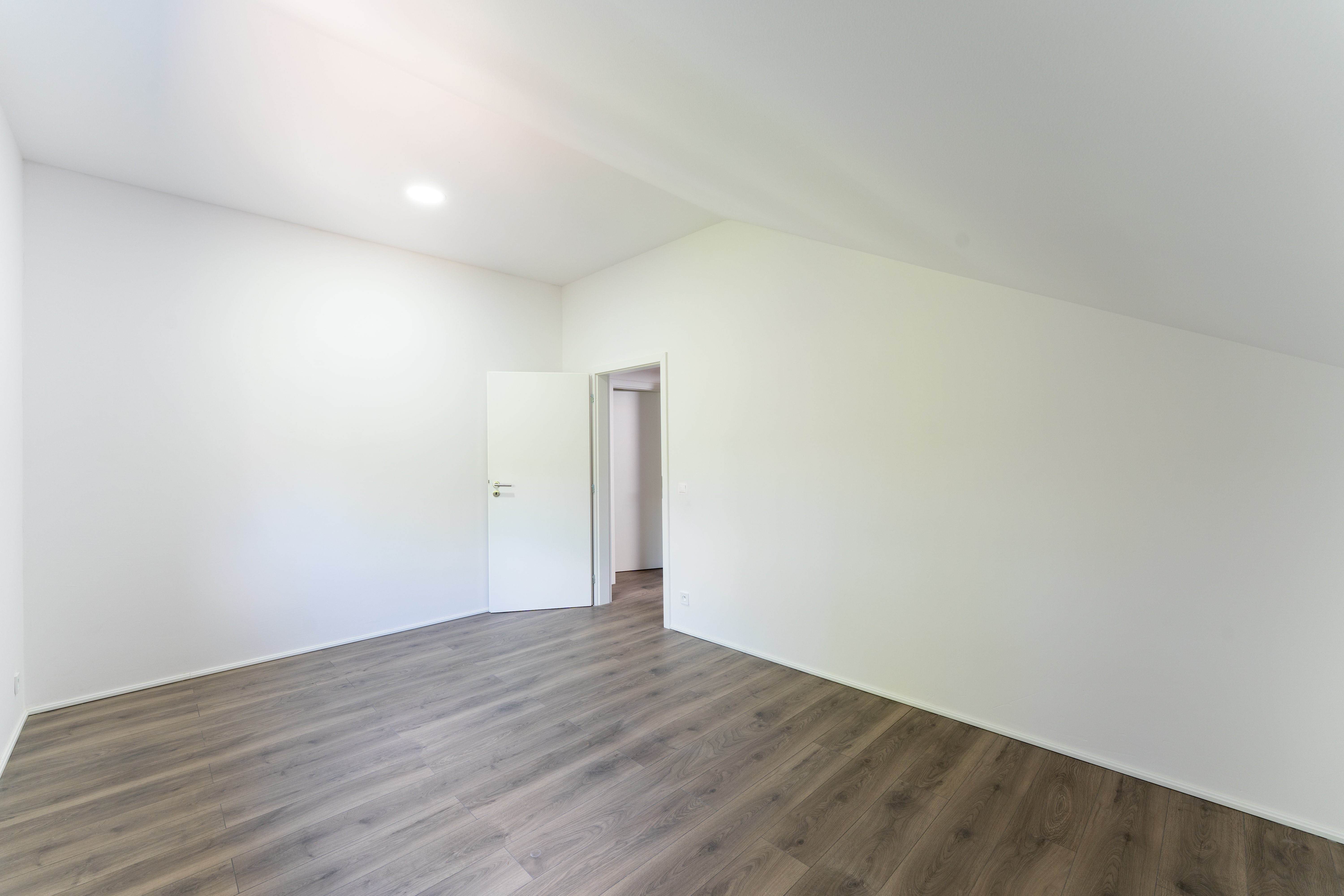 Attic room with wooden floor