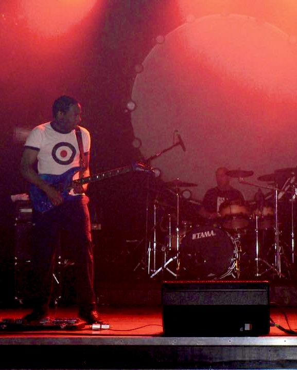fyoosha guitarist on stage with red lighting