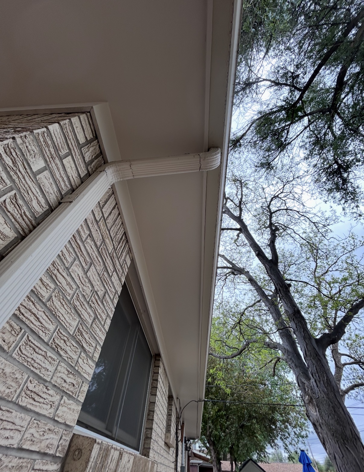 Exterior painting work on brick home
