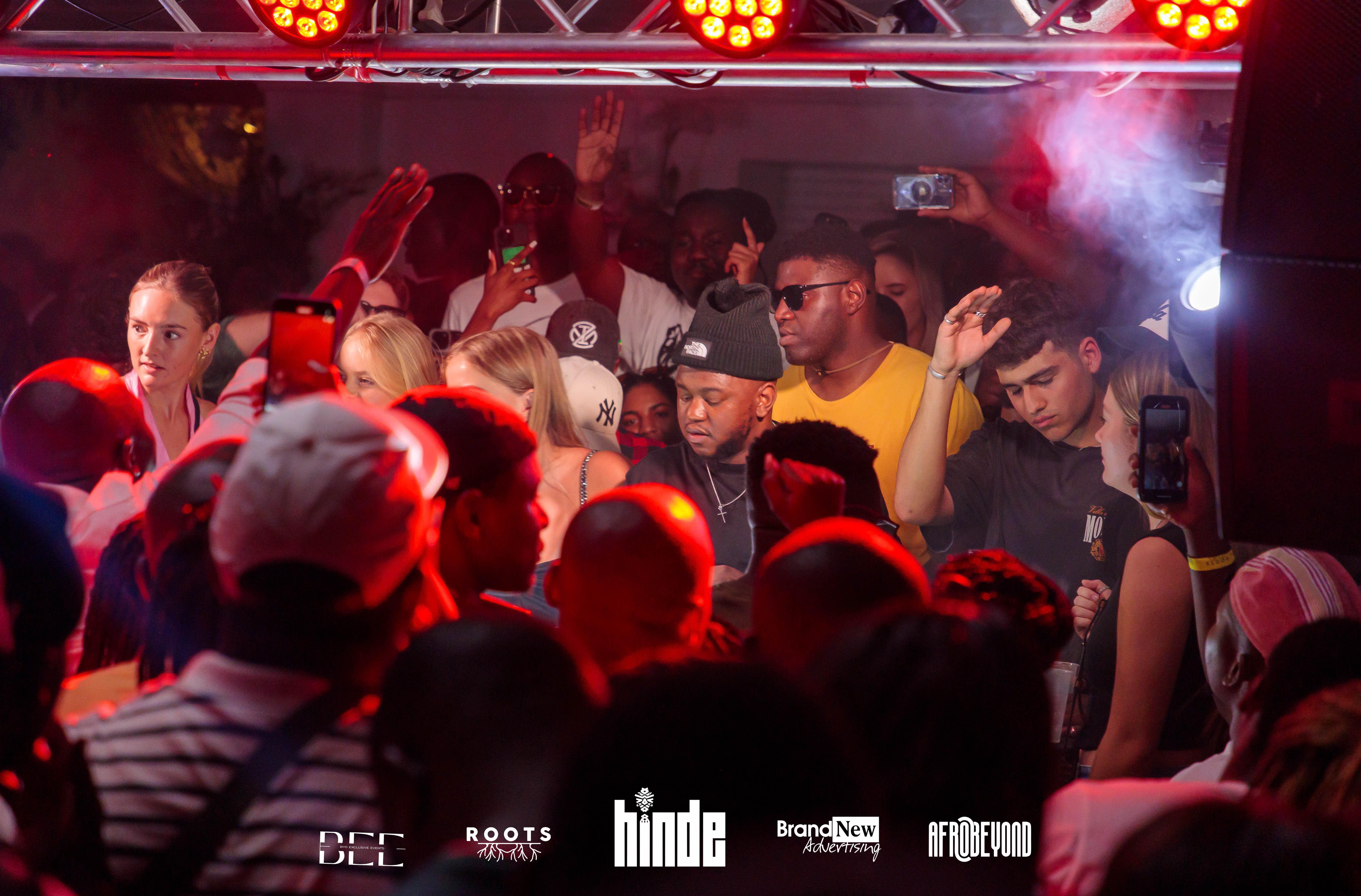 Intimate concert scene with red lighting