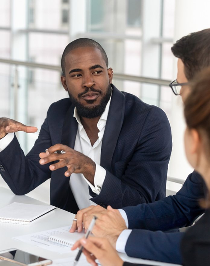 Manager in team meeting discussion
