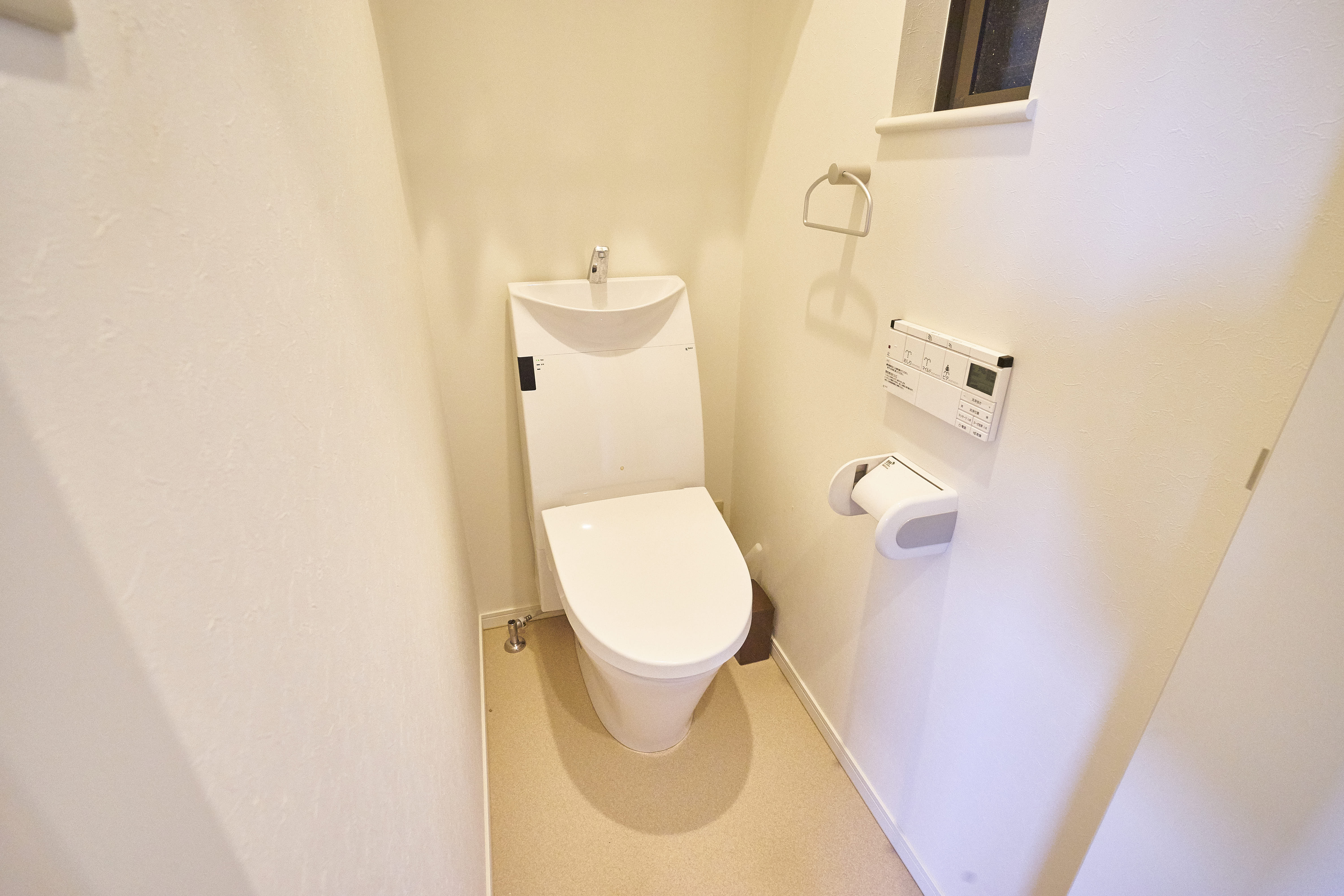 Clean 2F toilet room with Japanese toilet and integrated sink