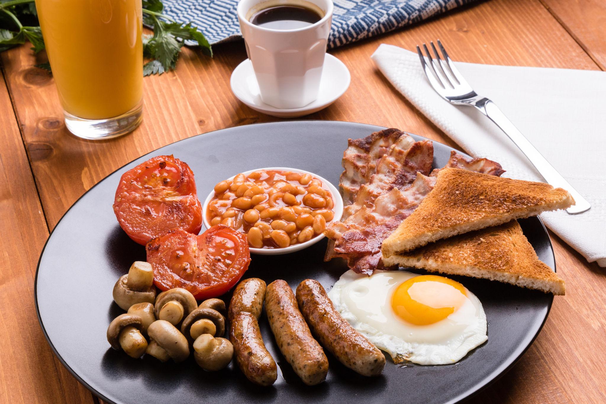 Full English breakfast plate with coffee