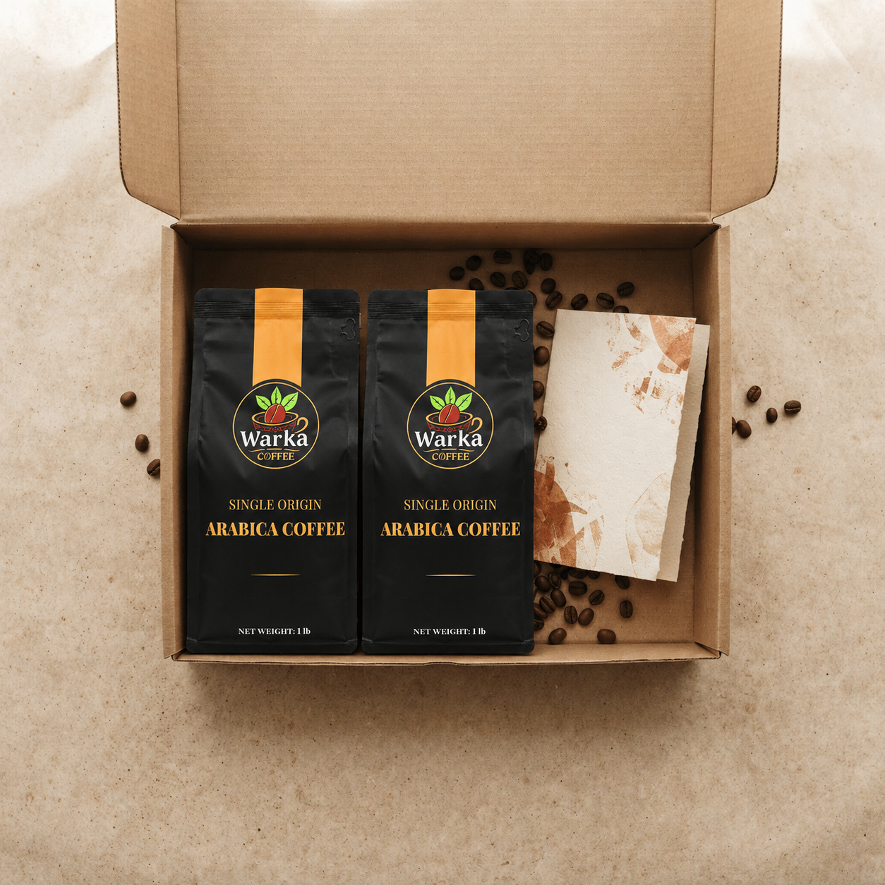 Open Warka Coffee shipment with two Arabica coffee bags, roasted beans, and a tasting card