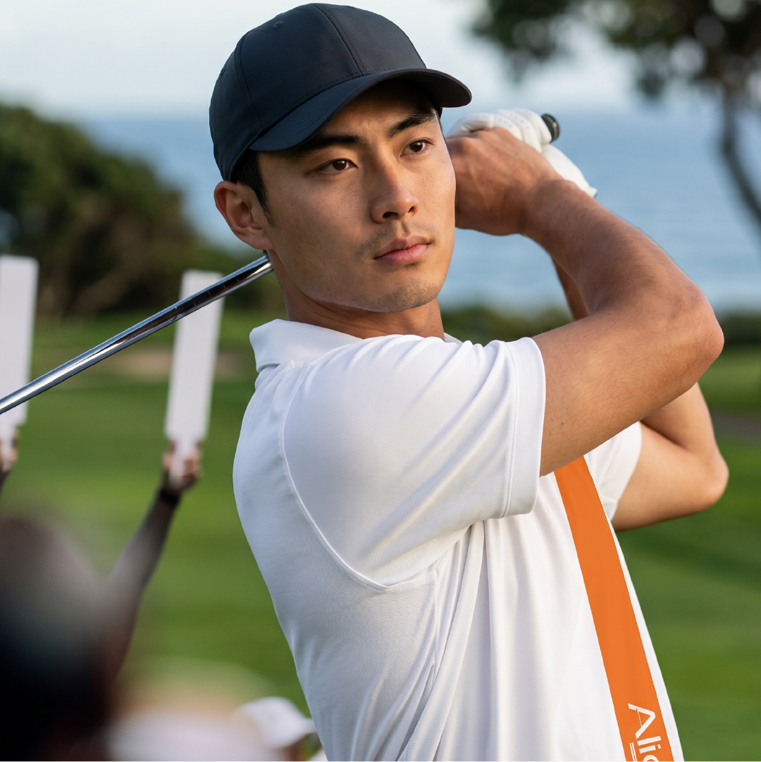 Golfer mid-swing action shot