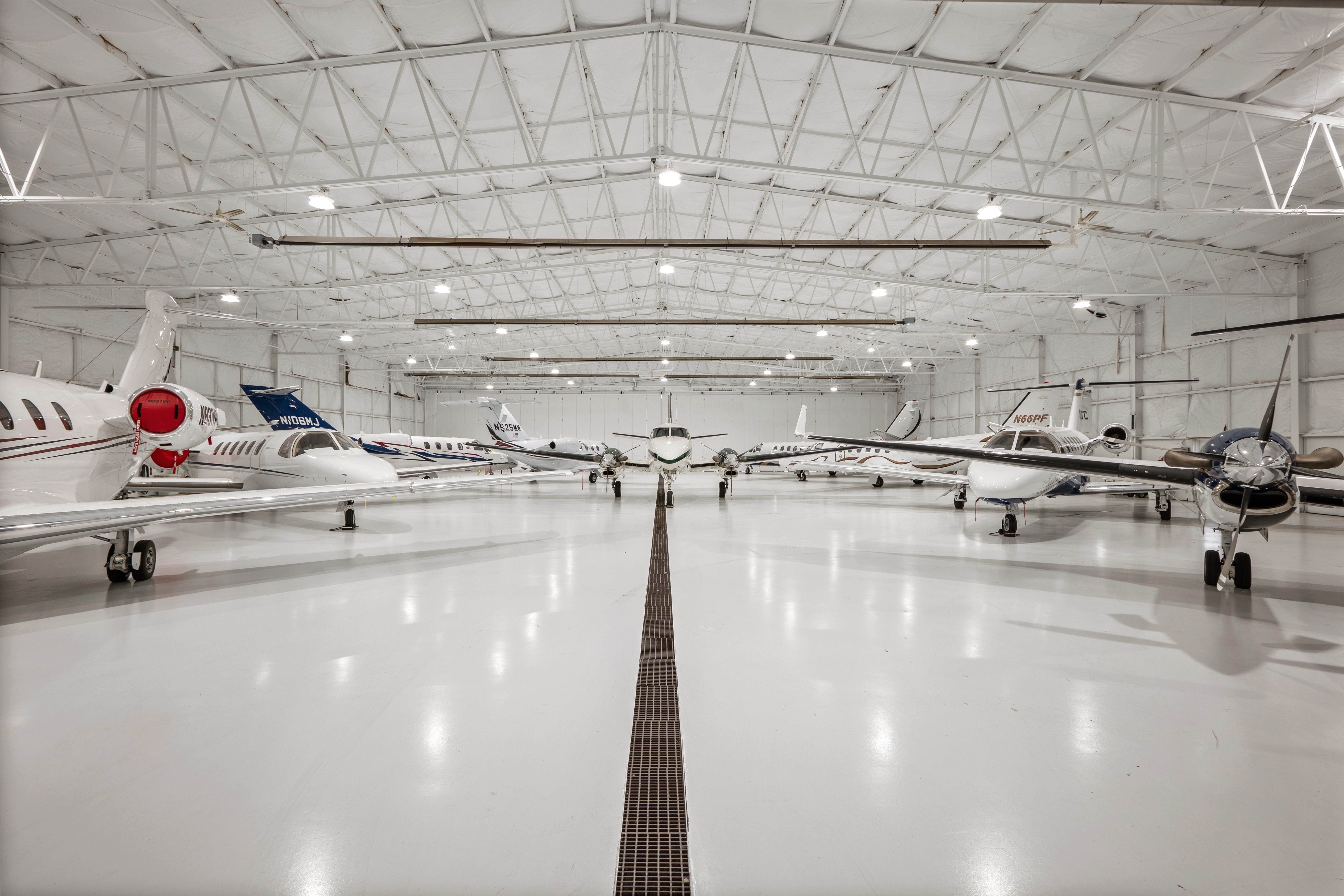 Aircraft parked inside Michigan Aviation’s bright hangar