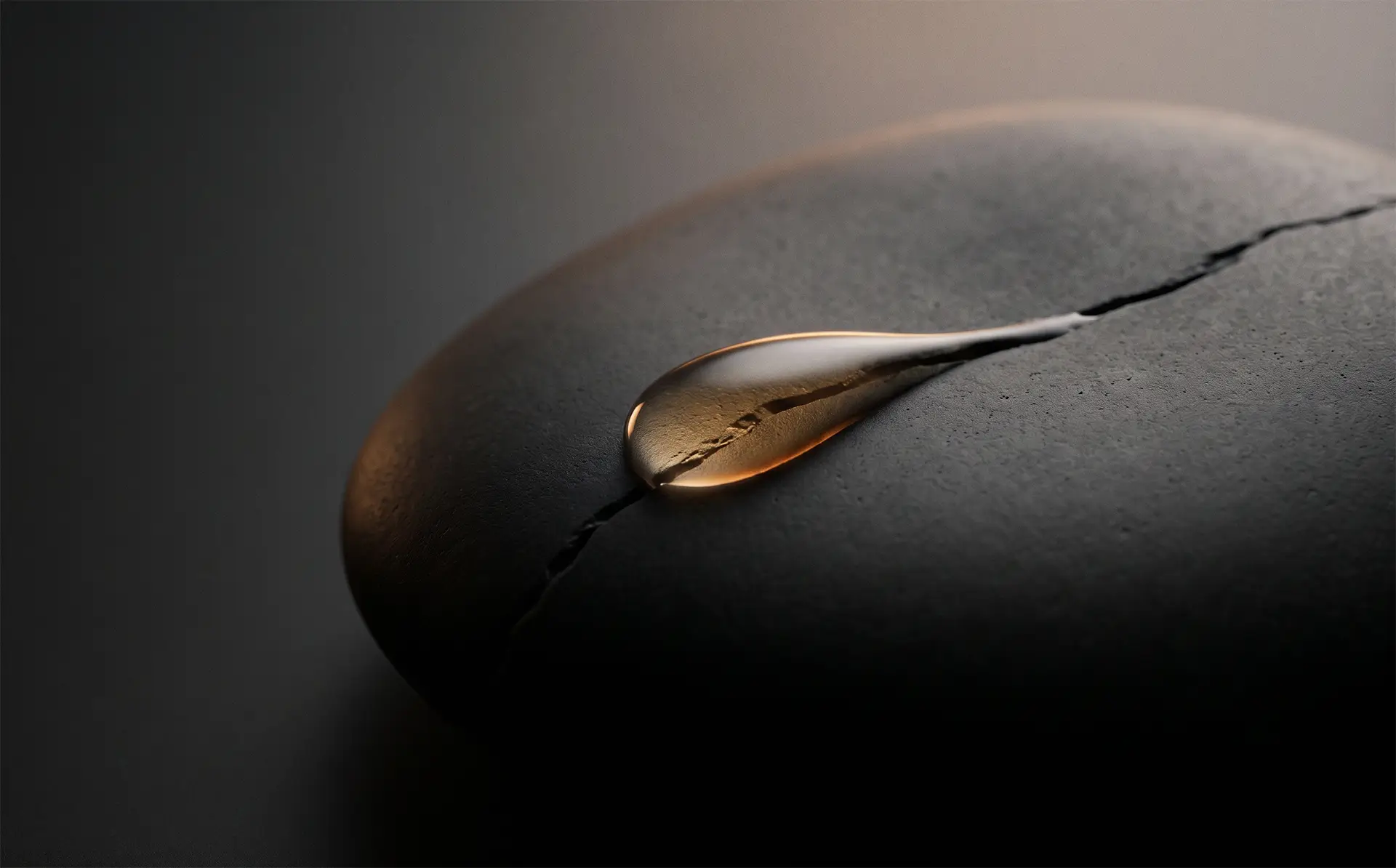 Amber droplet on dark stone — Recovery & Repair