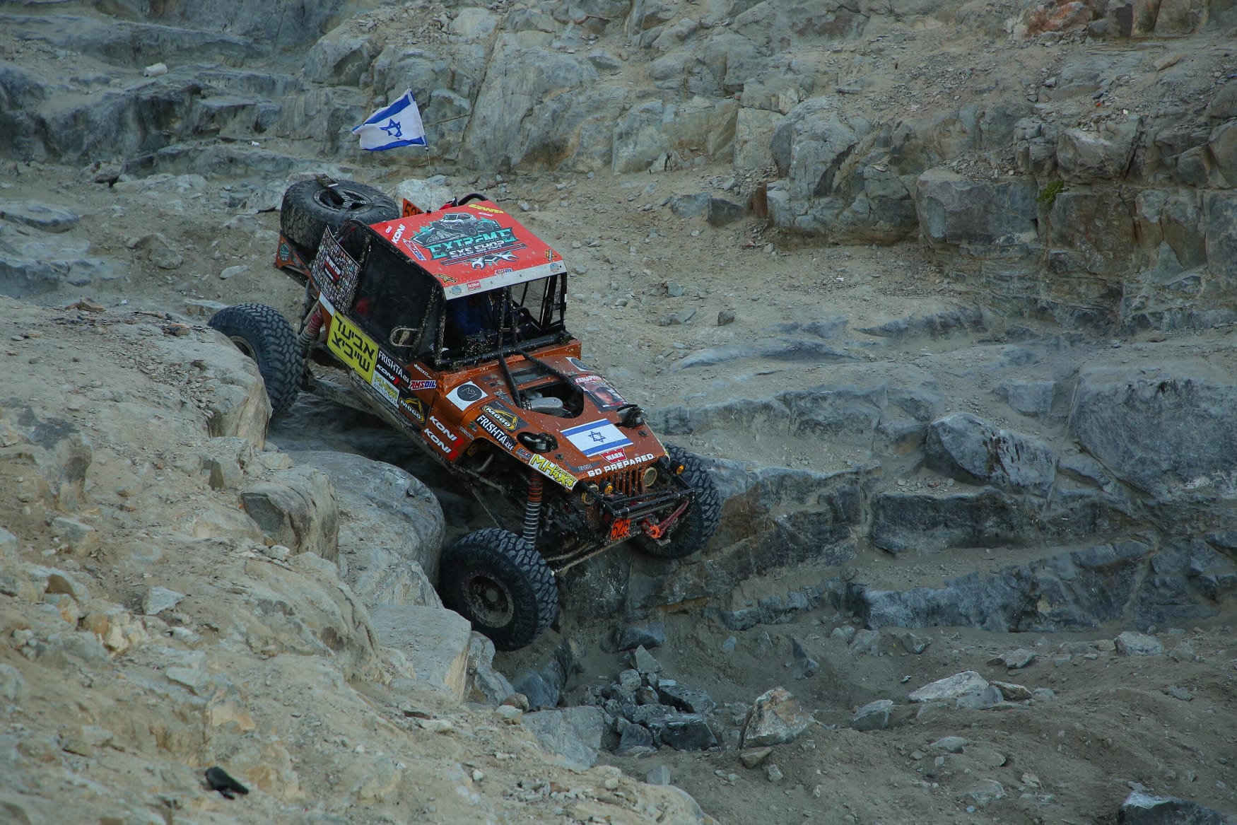 Israeli off-road racing vehicle conquering rocky terrain