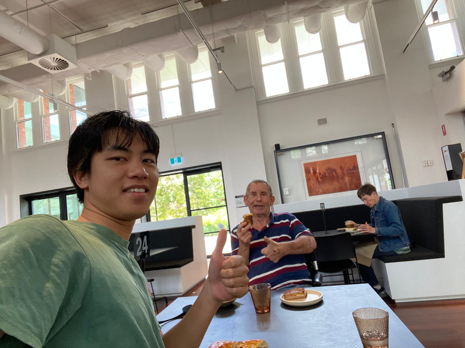 Support worker and participant at cafe