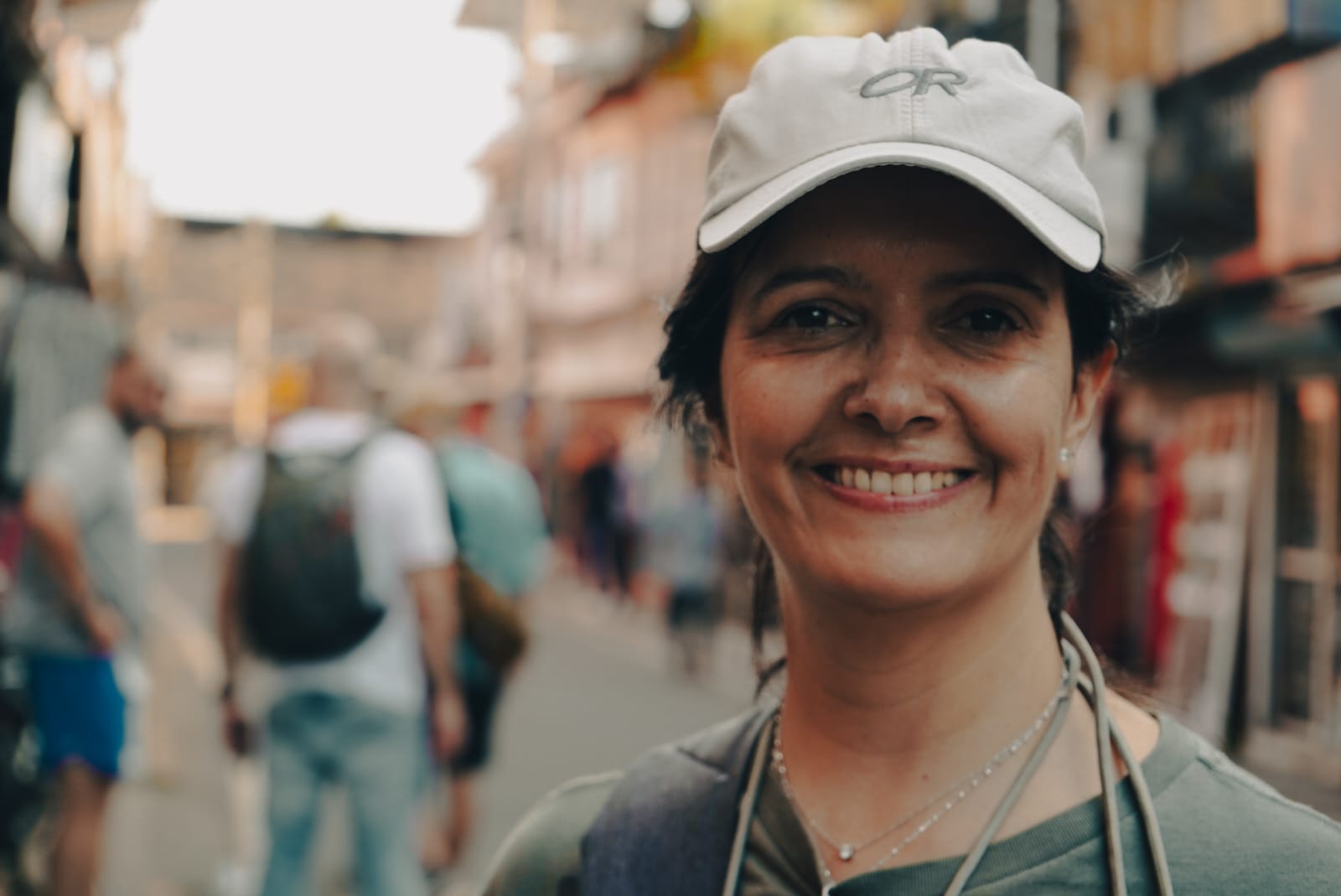 Happy female traveler portrait in Fort Kochi market