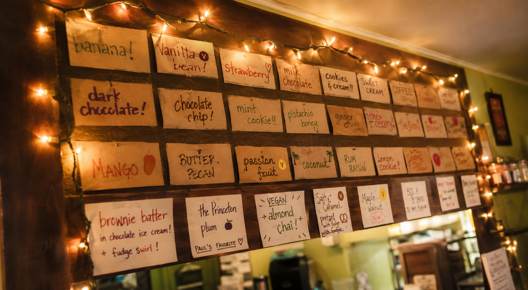 Interior flavor board with handwritten index cards and string lights