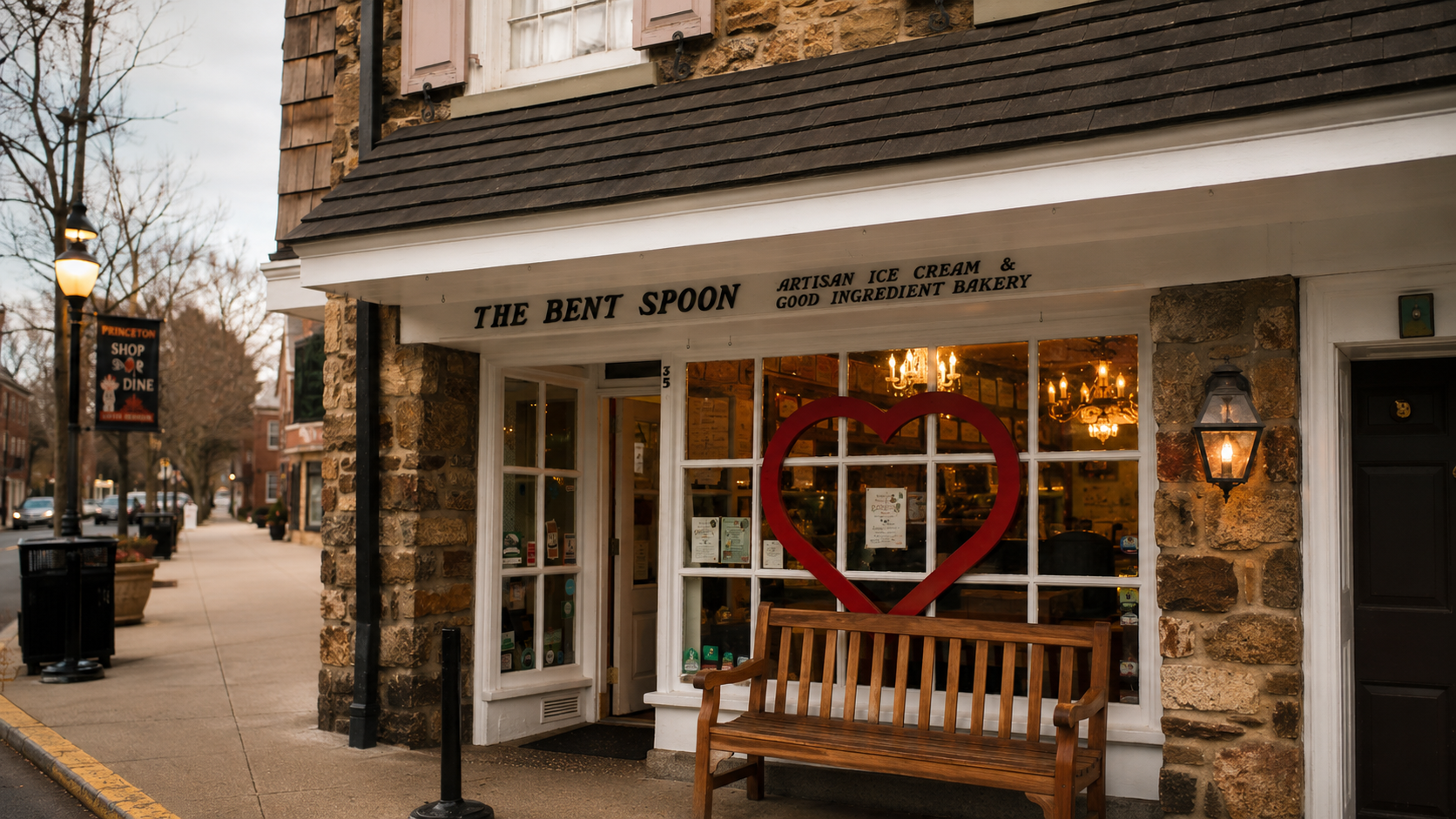 The Bent Spoon exterior storefront with stone building and red heart in window