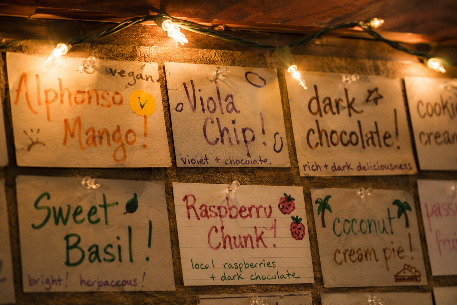 Handwritten flavor board index cards with string lights