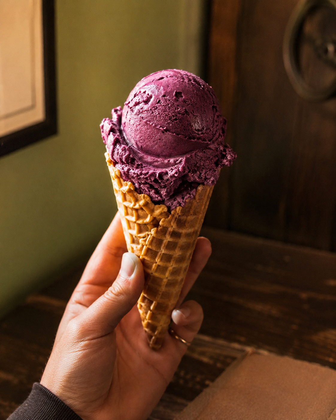 Vivid viola chip ice cream scoop in waffle cone