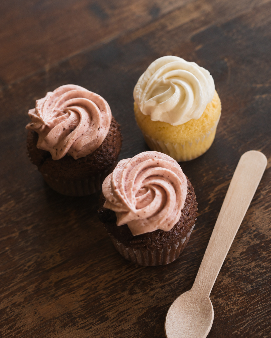 Mini cupcakes with pink and white frosting