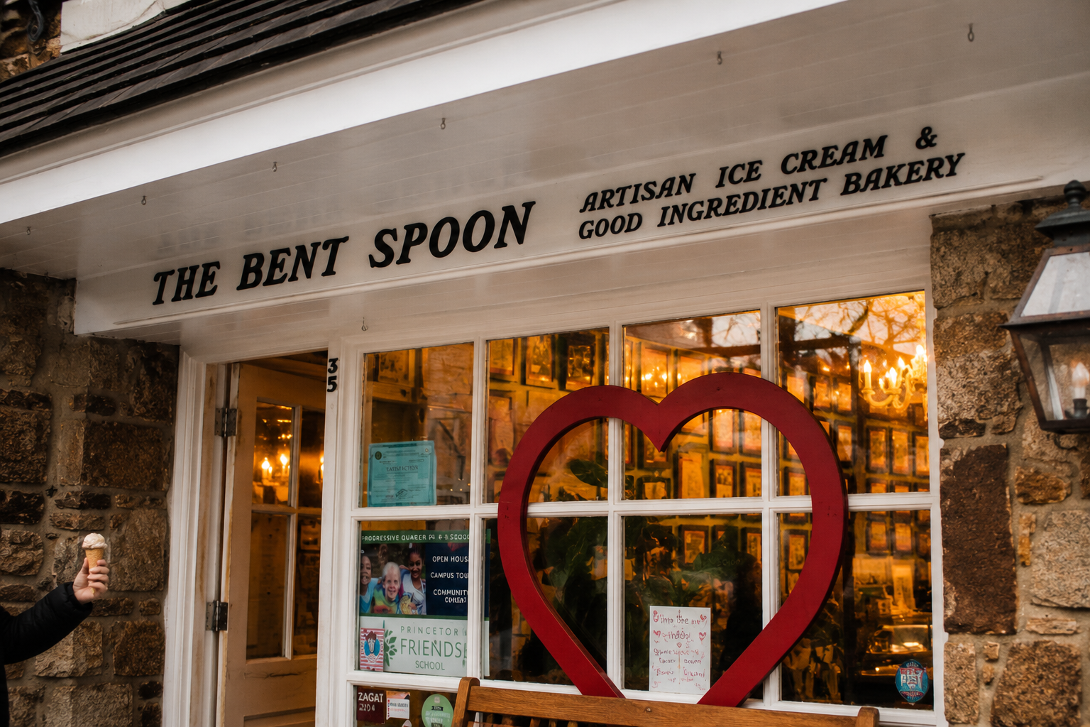 Exterior storefront with white fascia and red heart in window