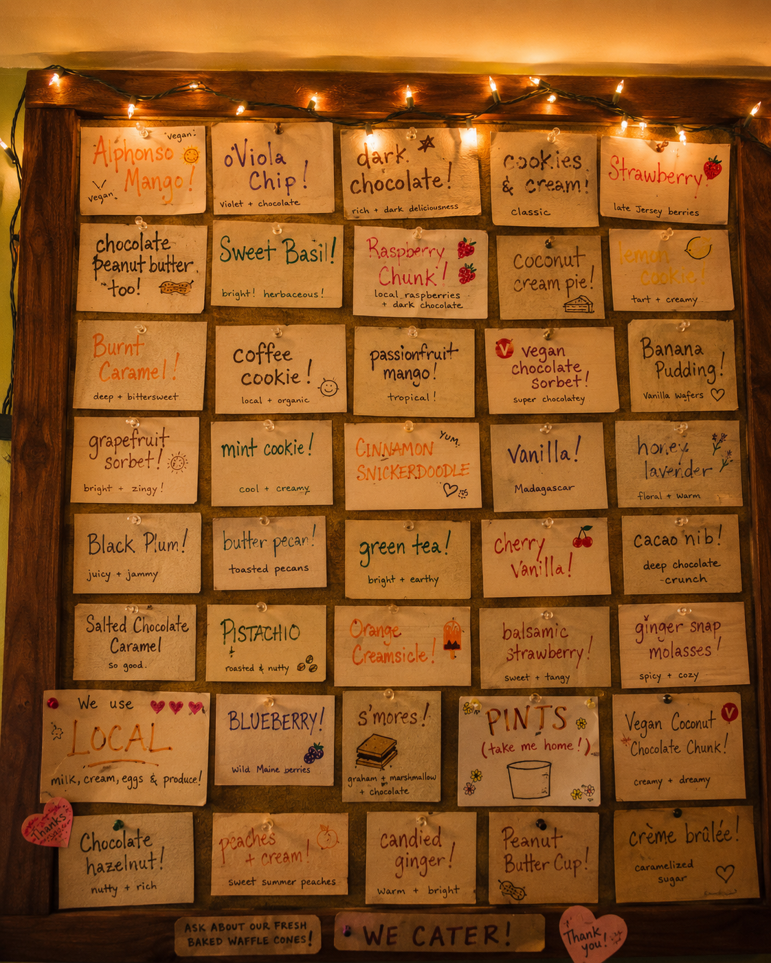 Interior flavor board with handwritten index cards and string lights