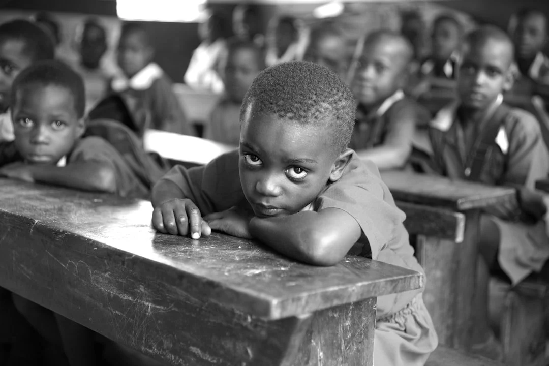 A student resting on a classroom desk