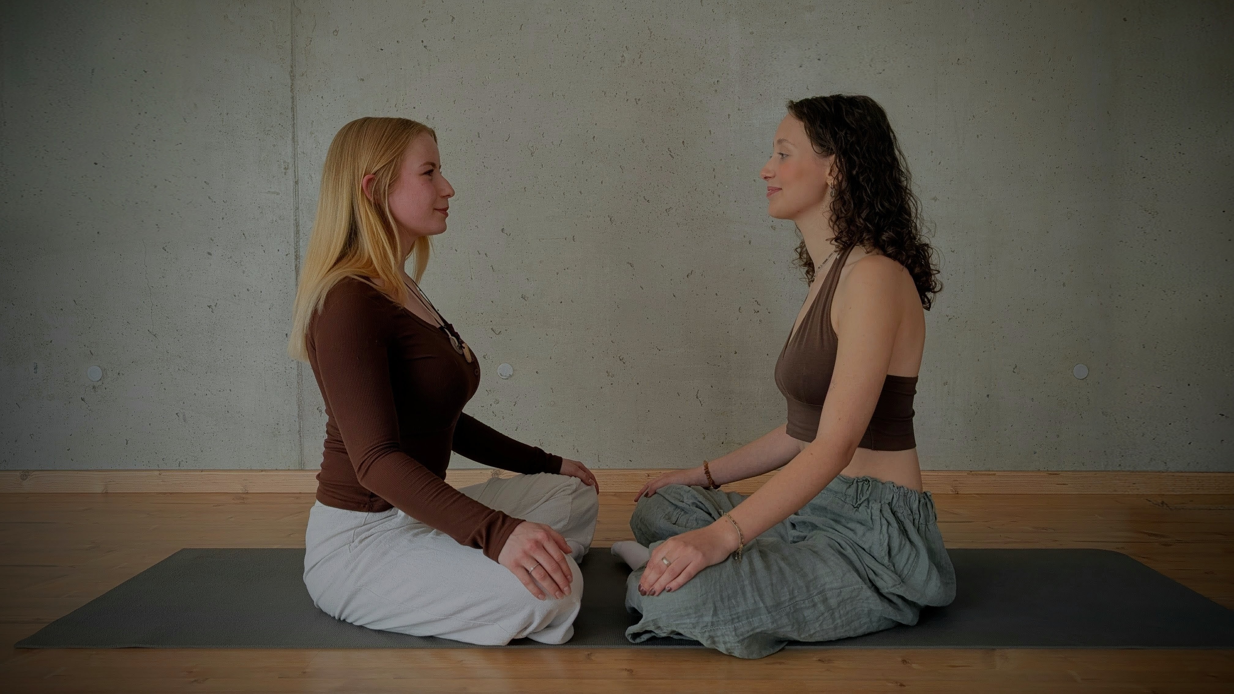 Two women sitting across from each other
