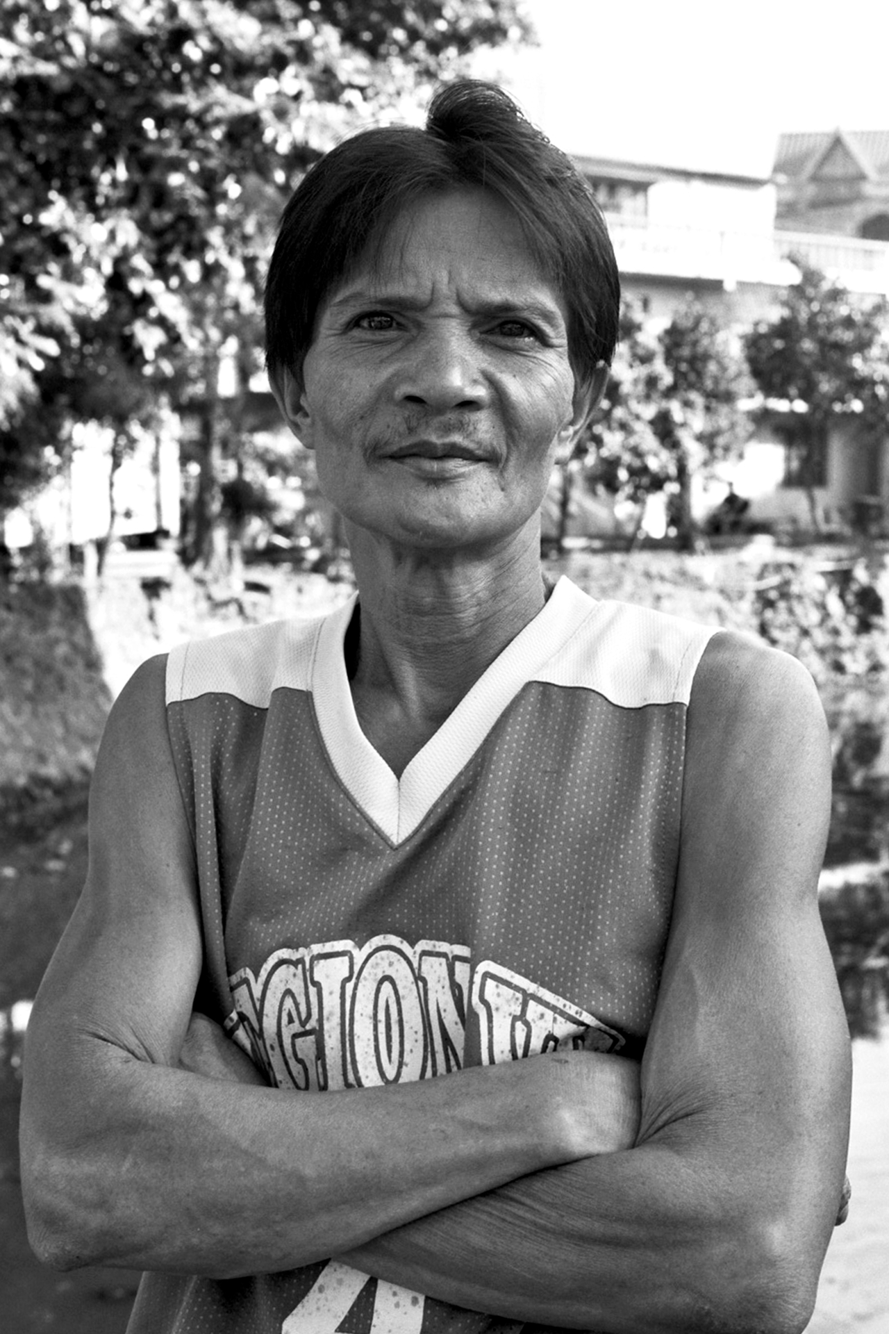 Portrait of man wearing Giants basketball jersey with arms crossed