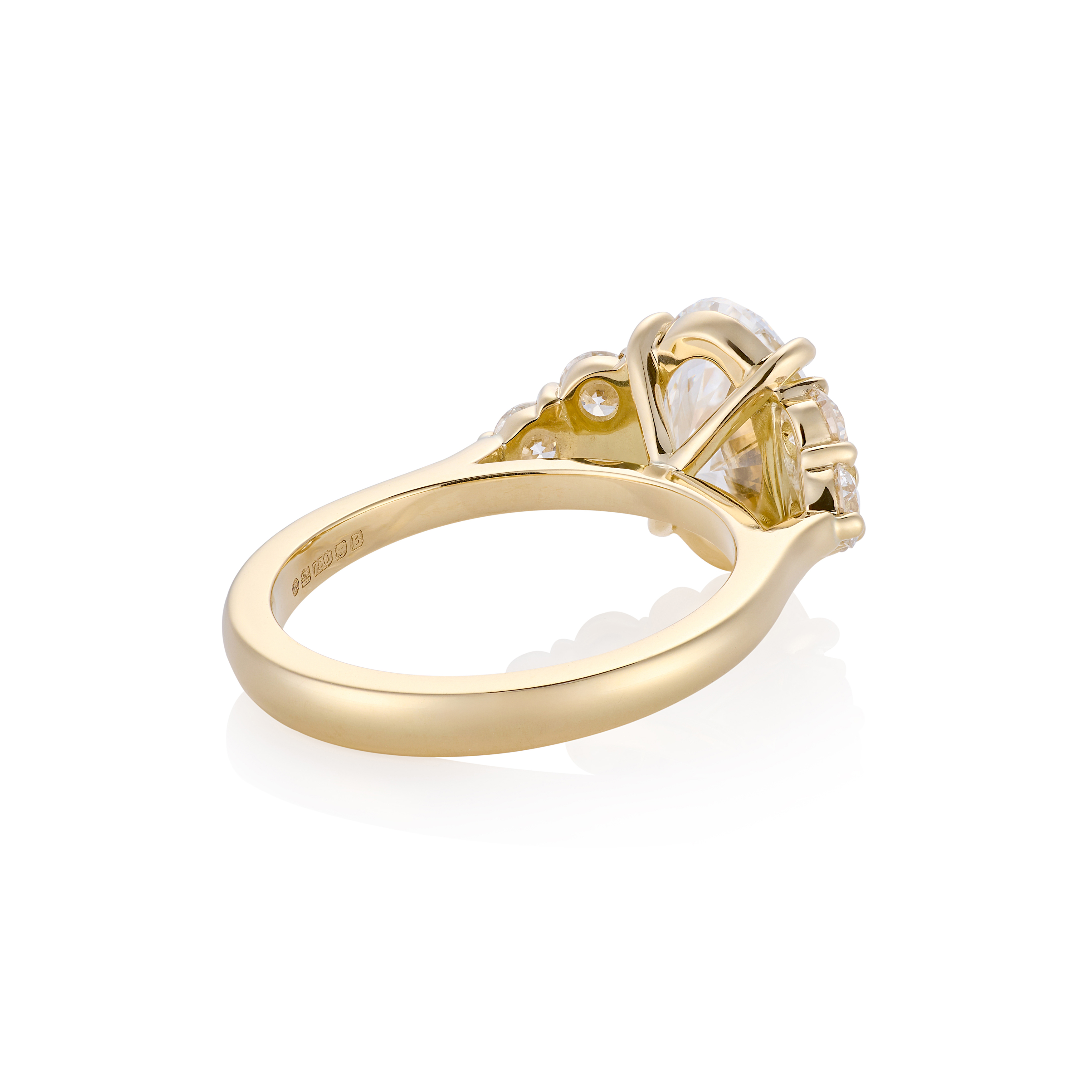 Oval with six round diamonds, side profile