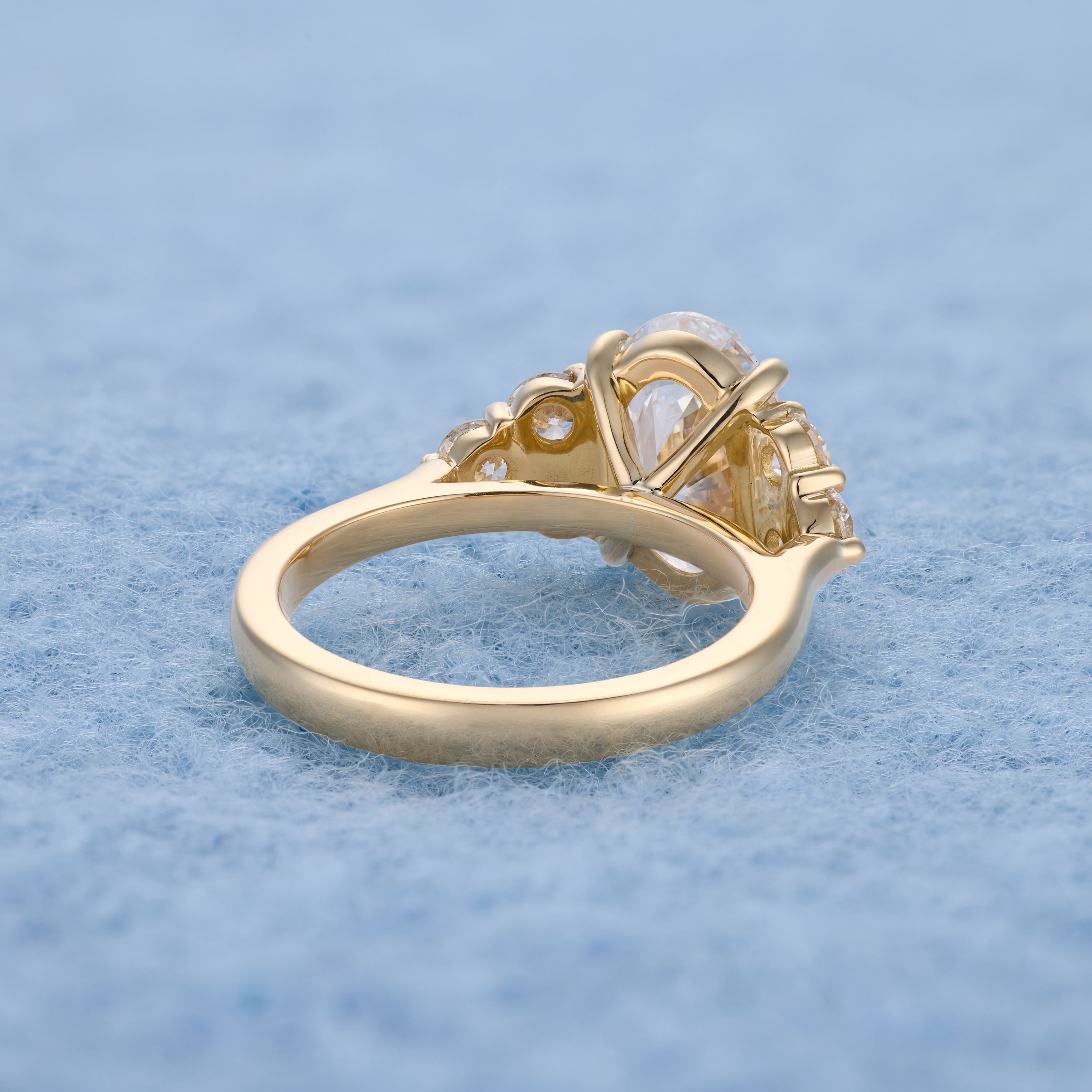Oval with six round diamonds, side angle