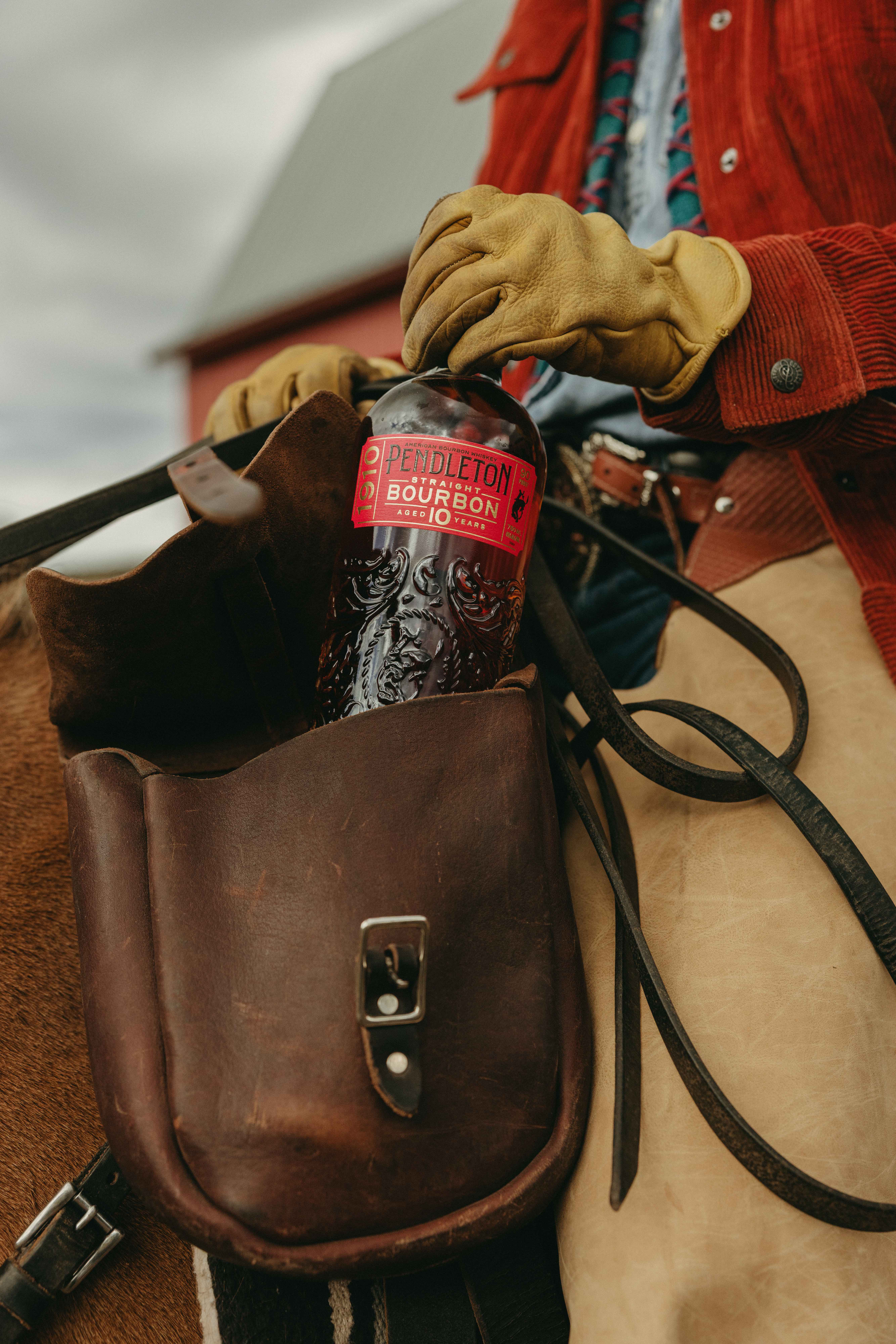 Pendleton Bourbon bottle in leather saddlebag