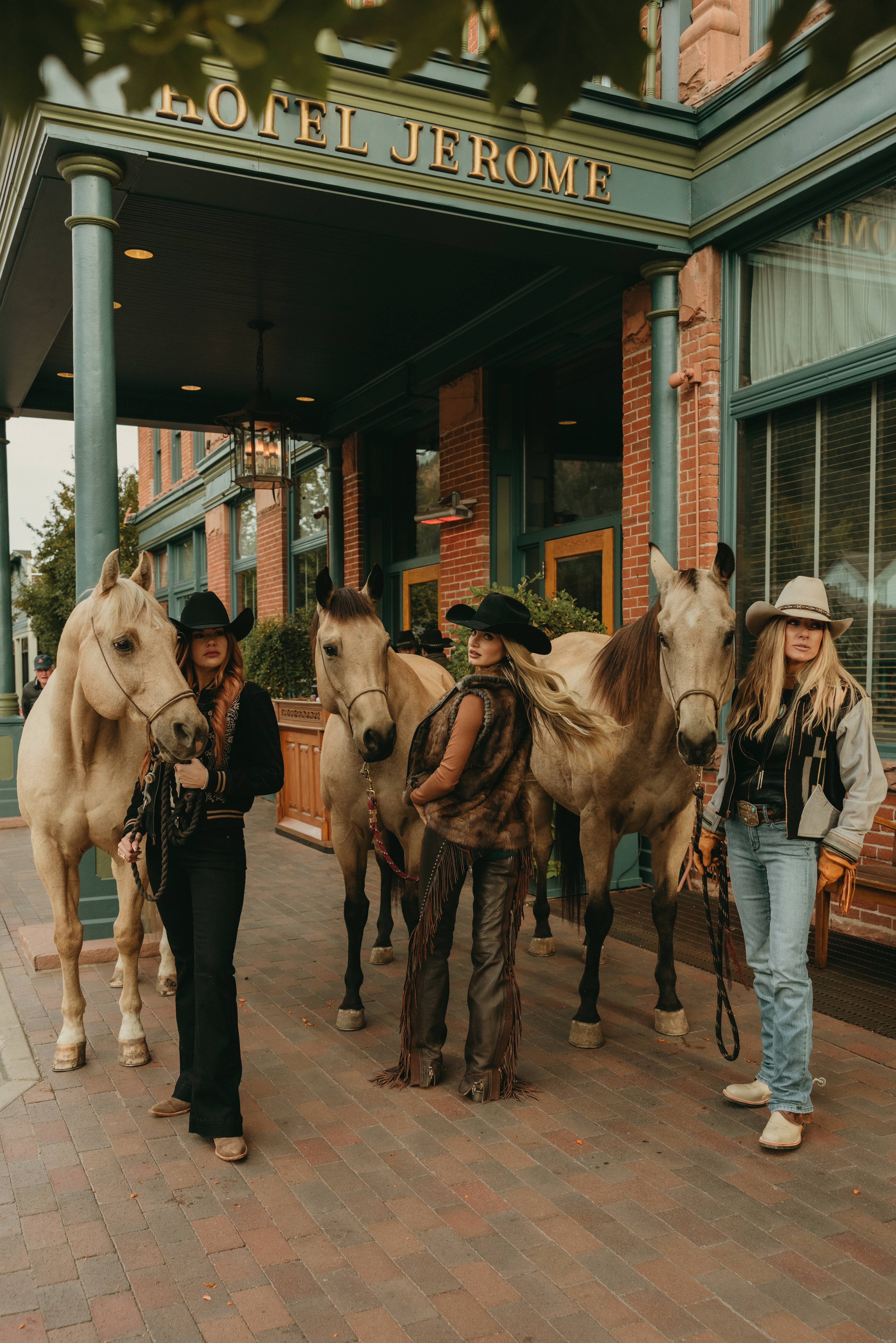 Three women with horses at Hotel Jerome
