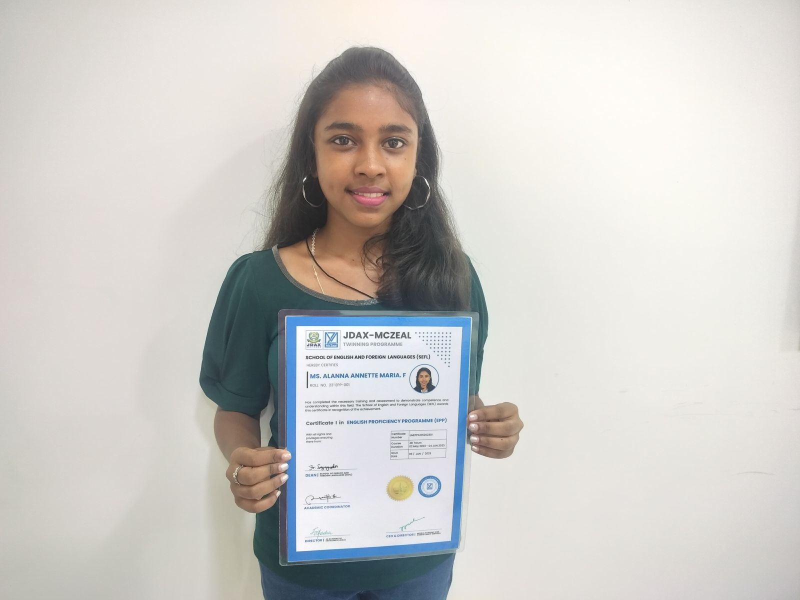 Student Alanna Annette Maria F with Certificate