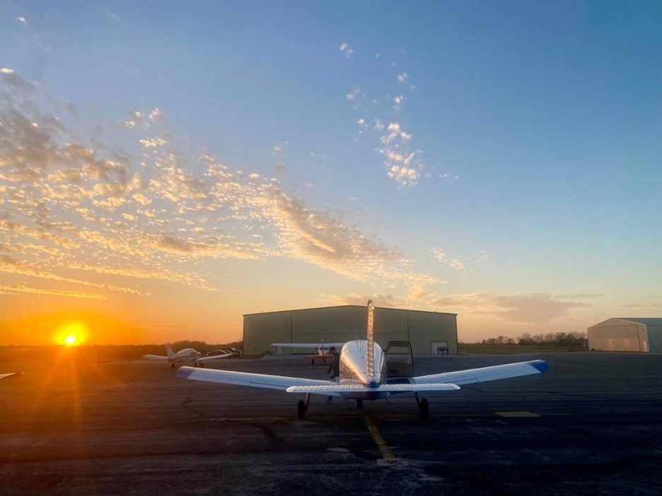 A small private aircraft on the ramp at sunrise, ready for an ordinary morning flight.