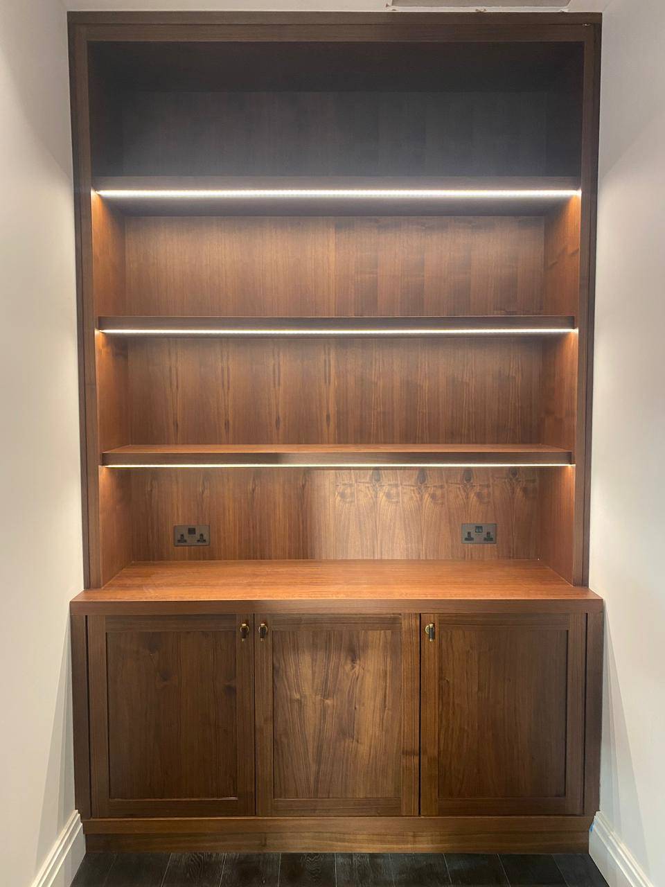 Custom wooden shelving with LED lighting